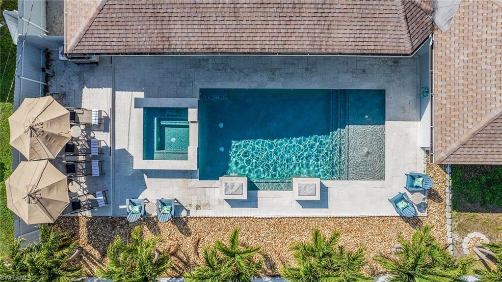 A rare and versatile opportunity in Cape Coral, this turnkey property offers something truly special: a beautifully designed main residence plus an attached garden apartment/guest home with its own private living space and entrance. Ideal for multigenerational living, extended family, long-term guests, a private home office, or investment potential, this unique feature sets the property apart and creates exceptional flexibility for today’s lifestyle.

The main residence offers three bedrooms and two baths with comfortable, inviting living spaces featuring granite countertops, stainless steel appliances, and porcelain tile flooring. Built in 2020, the one-bedroom, one-bath garden apartment provides privacy and independence while remaining conveniently connected to the property.

Outside, the Southwest Florida lifestyle takes center stage. The custom saltwater pool and spa create a private backyard retreat surrounded by an expansive travertine pool deck and spacious covered lanai, offering abundant space for outdoor dining, entertaining, and relaxing year-round. A convenient pool bath with shower adds to the functionality of the outdoor living area. The fenced yard provides additional privacy, while the generous corner lot and trailer entrance offer even more versatility.

The property has been thoughtfully maintained and improved with a newer roof, newer hot water heater, newer pool heater, and an air conditioning system still covered under a 10-year warranty.

Offered turnkey and located in a quiet Cape Coral neighborhood, this distinctive property combines comfortable living, exceptional outdoor spaces, valuable updates, and a rare secondary living arrangement. Whether envisioned as a full-time residence, seasonal retreat, multigenerational home, or investment property, this move-in-ready property offers exceptional flexibility and an outstanding opportunity to enjoy the Southwest Florida lifestyle.