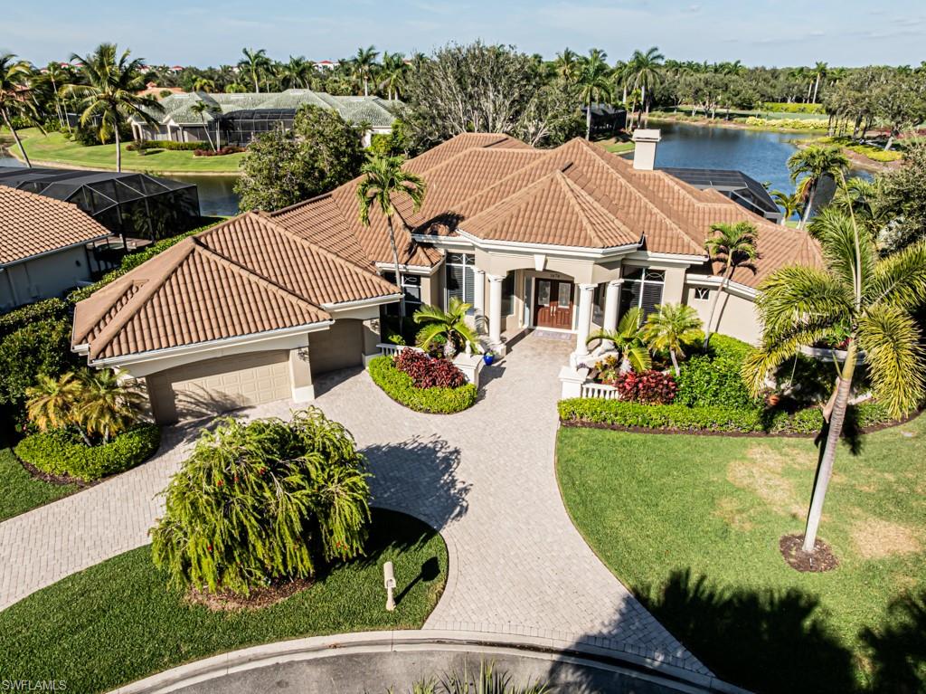 A rare offering in sought after Marsh Links, a private enclave located in the World Class Community of Pelican Marsh in North Naples. Enjoy stunning views from the oversized private lakeside setting. Situated on a cul-de-sac, the property is uniquely private and quiet. Roughly 3/4 acres, the property is flanked by the Championship Pelican Marsh Golf course. The home has a very elegant design, timeless in nature. Four large suites and four and a half baths surround the newly renovated gourmet kitchen featuring Sub Zero refrigeration, Wolf gas stove and Wolf convection steam oven. A Wet Bar with beverage cooler is located off of the family room joined by a formal dining room, living room and office/den. Views are amazing out to the covered Lanai and pool area which overlooks a large lake with fountain and Country Clubhouse property in the distance. Relax on the expansive Lanai with a covered summer kitchen perfect for grilling with tons of space for entertaining. Picture frame pool screening keeps the view perfect. The level of finish is superb, Travertine flooring, Custom Built-ins and moldings throughout. Oversized three car garage includes a large storage room. Roof, Lanai screen and all major systems have been updated.