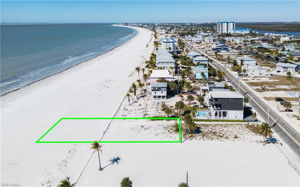 ***Beachfront Property on the Gulf of Mexico*** Discover the perfect canvas for your dream beach home with this exceptional vacant beachfront property directly on the Gulf of Mexico. Located in the heart of Fort Myers Beach, this prime location offers the ideal balance of convenience and privacy. Enjoy easy access to the vibrant spots of the island while relishing the peace and quiet just moments away from the action. This lot is uniquely positioned behind other properties, providing a buffer from Estero Boulevard and keeping your future home away from traffic views and noise. This property is not just a vacant lot, it’s an opportunity to build a custom residence tailored to your exact specifications while following the latest building codes. Whether you envision a modern coastal retreat or a classic beach cottage, the possibilities are endless. Don’t miss out on this rare chance to create your own piece of paradise. Embrace the lifestyle you’ve always dreamed of and make this beautiful beachfront property your own!