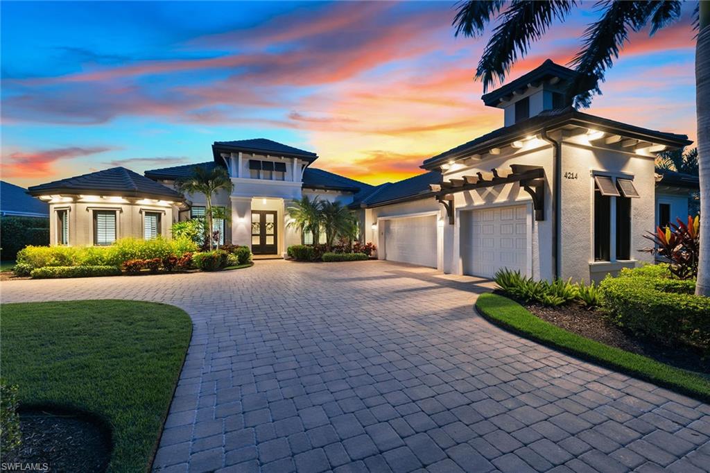 Rarely available Normandy II Stock Signature home in highly regarded Quail West Golf and Country Club. This upgraded and immaculate single-owner home boasts 4 bedrooms plus study, 4.5 baths and three-car garage, and was featured in the Parade of Homes. The extraordinary museum-style front doors lead to an open plan and breathtaking view of the pool and expansive water view. Hardwood and porcelain flooring throughout, along with exquisite ceiling details, impact glass, plantation shutters, crown molding, surround sound, premium motorized blinds and custom built-ins. This pristine home is perfect for entertaining. Gourmet kitchen featuring white cabinetry, quartz, subway tile, stainless, gas cooktop, wall oven and island. The expansive outdoor living is impressive with stunning southwest lake views, salt pool, panoramic screen, gas fireplace, fire bowls, sun shelf, water features, outdoor kitchen and beautiful sunsets. Spacious rooms include a heavenly primary suite in addition to a guest suite that lives like a second primary. Prestigious Quail West amenities include two championship golf courses, tennis, pickleball, dining, a great fitness center and an extensive activity calendar.