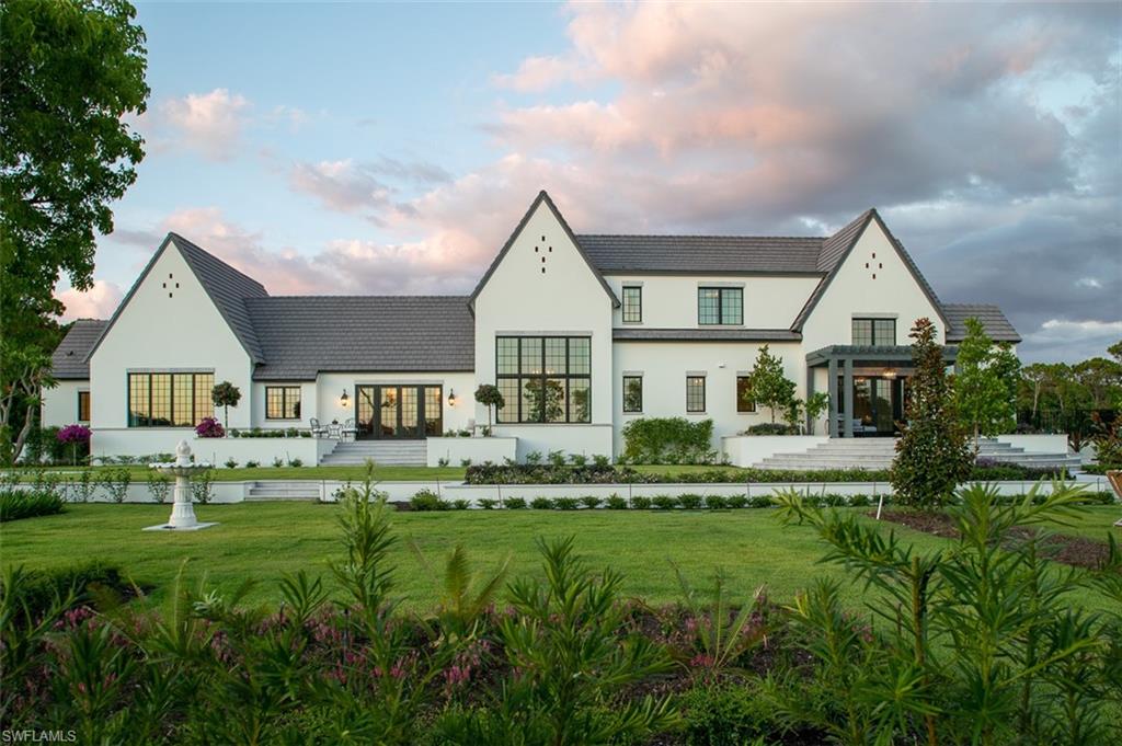 Located in the Audubon Country Club in North Naples and built by The Williams Group, this newly constructed McAlpine-inspired estate is a meticulously curated oasis that embodies tranquility. Move through this 5+bedroom, 6-bathroom masterpiece atop imported stone flooring, and bask in the beauty of the arched windows, cathedral ceilings, and opulent finishings that elicit a modern art deco flare, featuring striking nickel medallion wall tiling and scrollwork plaster ceilings. Relax into the hum of the water features on this nearly one acre property, including two fountains and a reflecting pond-inspired pool trimmed in Italian tile. Custom statues and antique calcium travertine designs punctuate the landscape, which has over 4,000 plantings bearing flowers to display in the kitchen flower emporium. With a bird sanctuary, mosquito abatement system, preserved estuary at the property’s edge, and Stealth Acoustic invisible speakers installed throughout, no detail was spared in planning this habitable work of art. The Audubon Country Club is a private golf community offering a fitness center, tennis courts, dining, and more. See listing video for additional details.