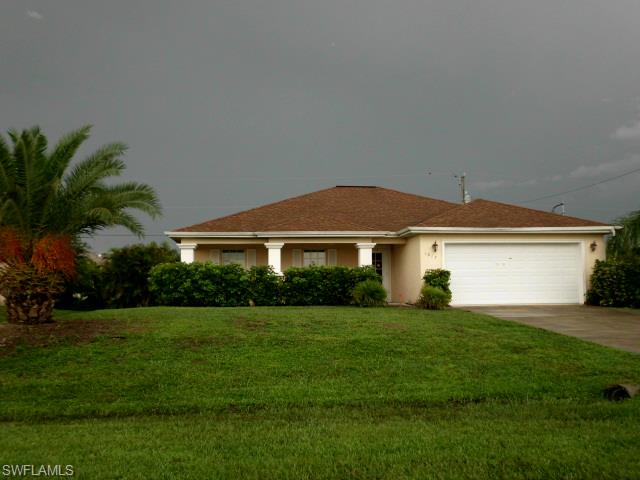 NW Cape Coral location with in-ground pool!  This CBS construction built in 2006 offers mature landscaping, 3 bedrooms, 2 baths and a 2 car garage.  .Some of the many features this home has to offer is as follows: split floor plan, vaulted ceilings, a private den, window treatments, ceiling fans, interior laundry room, a screened lanai, open front porch, planter shelves, canned lighting, island kitchen, eat in breakfast bar, a custom inground pool with a planters. Centrally located close to schools, shopping and restaurants. Make your appointment today!