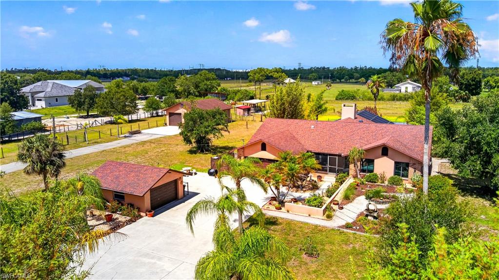 Back on the market due to no fault of the sellers**Where Country Living Meets Endless Possibility…**Welcome to **6670 Pangola Rd, Fort Myers, FL** — a rare **5-acre lifestyle property** designed for those who crave space, freedom, and versatility. Whether you're an **equestrian enthusiast, car collector, hobbyist, entrepreneur, or simply dreaming of peaceful acreage living**, this property delivers opportunities that are hard to find in Southwest Florida. This inviting home features **3 bedrooms + den/office**, ideal for working remotely or creating a private guest space, along with a bright **sunroom off the kitchen** where morning coffee comes with tranquil views of your property. The **screened front porch** offers a welcoming place to unwind, while the **expansive screened pool and spa area** creates the ultimate setting for entertaining, holidays, and family gatherings. Inside, enjoy peace of mind with **impact windows**, **whole-house reverse osmosis water system**, and **fresh interior paint**, providing a move-in ready foundation while leaving room for your personal style and finishing touches.
Outside is where this property truly shines: **Attached 2-car garage**Detached 2-car garage**Additional 1,200 sq ft workshop/shop** with endless potential for collectors, mechanics, tradespeople, or home-based businesses
**Pole barn**Chicken coop**Multiple fenced pastures** — bring your horses and livestock**Private pond** adding charm and country ambiance -Plenty of room for **RVs, trailers, boats, work equipment, and recreational toys**
For horse lovers, hobby farmers, or those wanting room to roam, this property offers the flexibility to create your own private retreat. Car enthusiasts will appreciate the abundance of garage and workshop space, while entrepreneurs can envision operating a **home business with room to grow**.
Conveniently located near the **Six Mile Cypress Slough Preserve North**, outdoor enthusiasts will enjoy easy access to **hiking, wildlife viewing, horseback riding opportunities nearby, and exploring nature**—all while remaining close to shopping, dining, schools, and everyday conveniences. Properties combining **acreage, a pool, multiple outbuildings, workshop space, and equestrian potential** are becoming increasingly difficult to find. This is more than a home — **it’s a lifestyle waiting for its next chapter.**
Bring your horses. Bring your projects. Bring your dreams. Welcome home.**