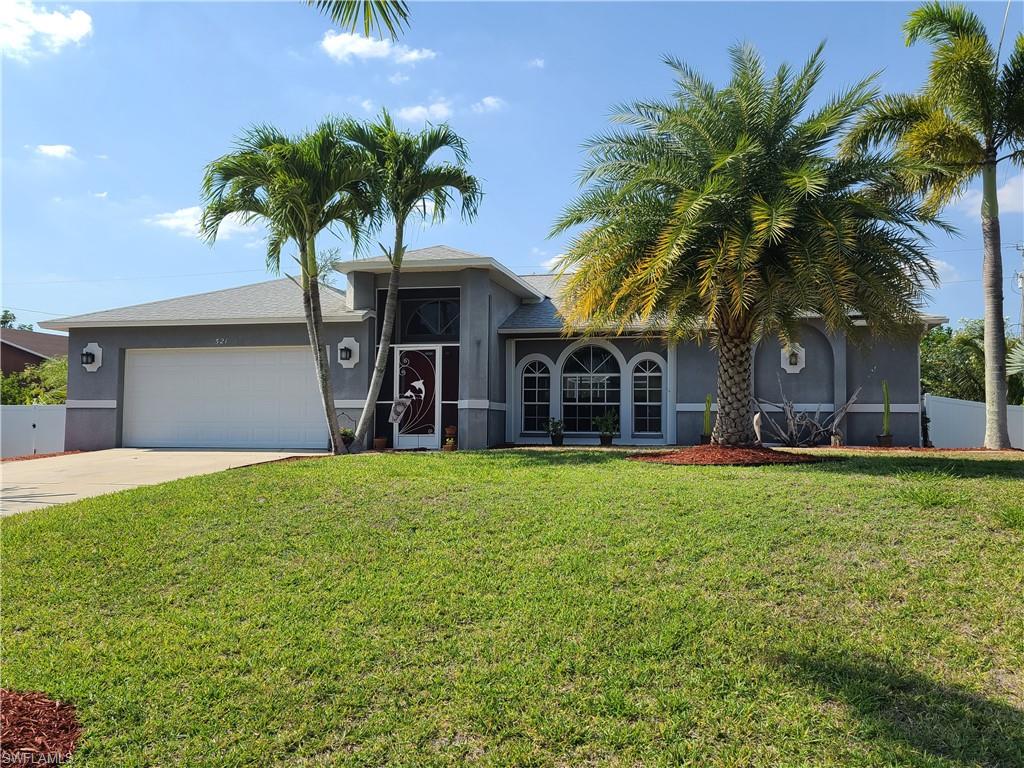 This home is ready for your final touches and truly speaks for itself!  As you arrive a well maintained and mature landscape spreads across the privacy fenced triple lot in a premier SW Cape neighborhood.  As you enter the homes foyer an open living room and triple sliders provide picture perfect views of a massive screened lanai with heated pool and spa!  To the left a dining area, large kitchen, two guest bedrooms and a newly renovated pool/guest bath await.  The laundry room is renovated as well!  Opposite the homes open floorplan is the generous owner's suite with a stunningly remodeled master bath which will not disappoint.  The rear of the home offers a private and secluded oasis with decorative landscape, mature fruit trees and palms.  A double gated side yard can provide space for recreation and storage or more!  This is the one - don't miss it.  With a a little sweat equity to finish up the easy spaces in this home you will have a gem to last for years of enjoyment!