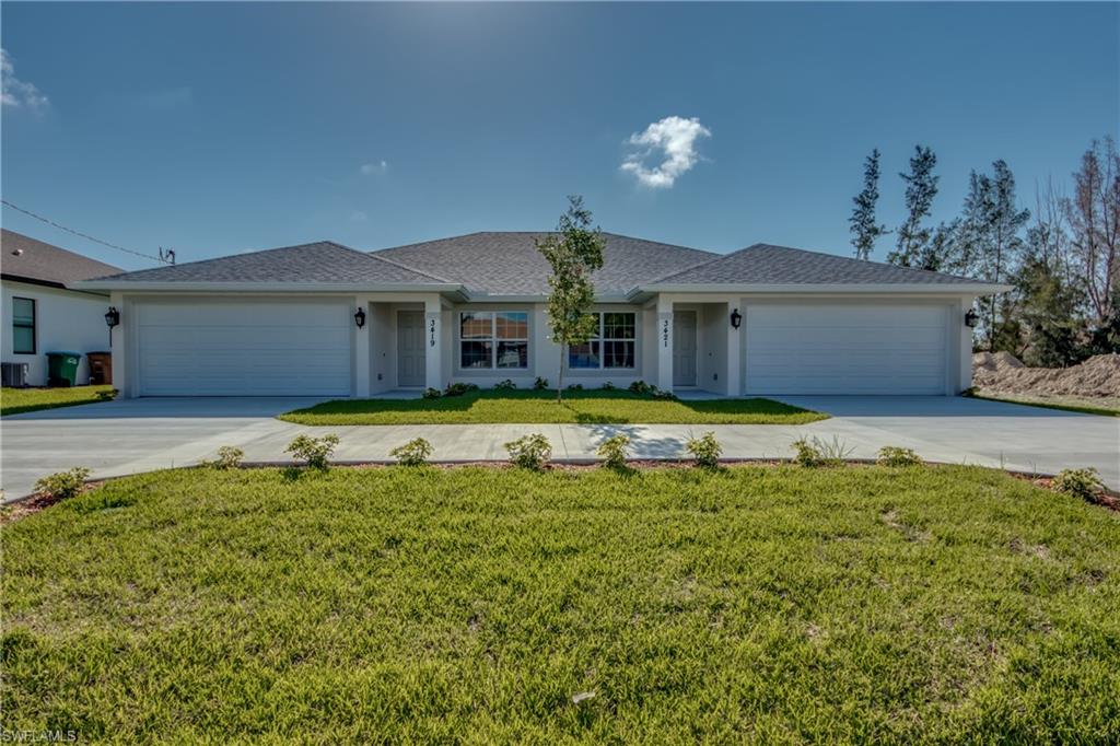 Beautiful duplex with 2 car garage on fresh water canal. This unit is all tile throughout the home and has a den in the front of home with pocket doors. The den would make a great office or playroom. . The kitchen has solid wood cabinets, stainless steel appliances and granite counter tops with counter top seating on the kitchen island. Master bedroom has walk in closet and walk in shower. There is a large 9 foot slider leading onto a screened in back lanai. All of the windows are hurricane impact windows and there are shutters for the sliders. Over sized driveway and a two car garage gives plenty of room for parking, Lawn care is included in rent.
