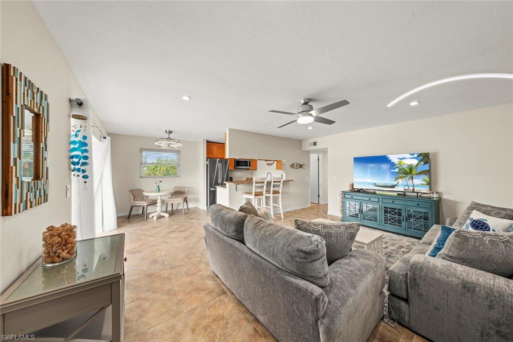 This beautifully updated 2-bedroom condo at Captains Walk is perfectly situated on Sanibel Island’s highly desirable east end! Enjoy easy on/off island access, proximity to beaches and restaurants, and a quiet residential feel. This elevated, top-floor corner unit features a private lanai, tile flooring, and a modern kitchen with stainless steel appliances and high-quality finishes. Relax on your lanai while watching island birds, rabbits, and passersby along the shared-use path, or head to the private dock for kayaking through serene canals and out to San Carlos Bay. Structural inspections and repairs have been completed in the complex, ensuring durability for another 50 years. Captains Walk offers covered parking, two community docks, and a soon-to-be-rebuilt community laundry room. Monthly rentals are allowed, creating a true island community feel. Just a short distance from the Sanibel Lighthouse, Grandma Dot’s, and Gulf beaches, this condo is the ultimate island retreat!