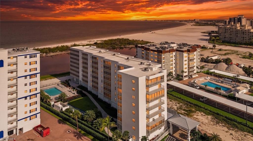 Wake up with breathtaking views of the Gulf from this beautifully maintained sixth floor condominium, ideally located on the southern end of Fort Myers Beach. This tastefully furnished turnkey residence offers two spacious bedrooms, two full baths and an inviting screened lanai where you can relax and enjoy spectacular sunsets and coastal breezes. The well appointed kitchen features stainless steel appliances, granite countertops and ample cabinetry, while the open living and dining areas flow seamlessly for comfortable everyday living or entertaining. A Nest thermostat controls the temperature. The accordion shutters allow for extra protection while you are away and offer a wider open view of the Gulf. Residents enjoy a secured lobby entrance, assigned parking and access to a welcoming community room. Step outside to experience a Geo thermal swimming pool, BBQ area and secure gated access to the white sands of Fort Myers Beach. Perfectly situated just across the street from CVS and Santini Plaza you will enjoy shopping, dining and entertainment right at your doorstep. Whether you're searching for a full-time residence, a seasonal retreat, or an investment opportunity, this exceptional beachfront condominium offers the best of Southwest Florida living.