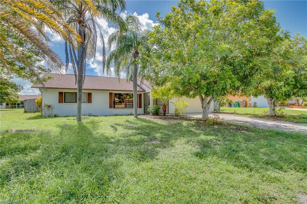Centrally located property in Southwest Cape Coral, this pool home features three bedrooms and two baths.  The living area and master bedroom have new carpeting.  Large living room adjoins dining area and kitchen to create the open floor plan everyone desires.  Spacious master suite has bath with tiled walk-in shower.  The second and third bedrooms are spacious as well and offer wood flooring.  The kitchen has ample counterspace with breakfast bar and all appliances included.  Enter the oversized screened lanai from sliders leaving the dining area and imagine the beautiful outdoor living space you can create.  Relax and take a dip in your private swimming pool with plenty of privacy provided by the stockade style fencing.  This home has City water and all assessments are paid.  That is a huge benefit!  Convenient to excellent dining, entertainment venues and shopping.  This home is ready for you to call home so book your private showing today.
