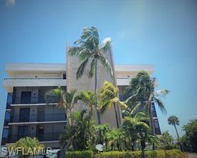 Rarely available, this stunning 3-bedroom, 2-bath condo offers breathtaking "big water" views from every window, providing an unparalleled experience of living surrounded by water. With over 1700 total sq. ft, the condo includes an oversized screened lanai and two additional screened balconies, allowing you to immerse yourself in the beauty of the surroundings. This is Coastal living at it's finest. And PRIVATE! Only 7 (SEVEN) condos in this building. However, this building is in the same community as Islands End beachside, where you have access to the private beach access and other amenities! A perfect waterfront lifestyle awaits.

Imagine starting your day with a smile as you watch dolphins' antics in the bay, accompanied by the mesmerizing sight of a gorgeous sunrise. The sun's reflection on the water during the day resembles diamonds dancing on the water, and much of the year you'll also witness our unmatched sunsets.

Convenience is key with the under-building parking space (#5), ideally located right outside the lobby door for easy access. Additionally, this 2nd floor unit comes with a private, ground-level storage room, providing extra space for your belongings.

Our world famous beach is just steps away with Lovers Key State Park, voted one of the best and most beautiful in the U.S., on the other side of Big Carlos Pass.  And the fishing....is fantastic!

Despite any potential hurricane concerns, this unit experienced minimal damage and is ready for immediate occupancy. Islands End amenities are currently undergoing restoration, promising a luxurious living experience with Tennis, Pickleball, fishing pier, gas grill, kayak rack/launch, 2 Community pools, Spa, beach walkway, small fitness studio & social area, under-building parking, storage closet, and ample guest parking. The elevators are operational and awaiting final inspections, ensuring seamless access to your beautiful condo.

With all these features and the promise of restored amenities, this condo at Islands End is an enticing opportunity for those seeking a waterfront lifestyle with comfort and style. Don't miss the chance to call this amazing condo your home and live the easy-going and uncomplicated Island dream.