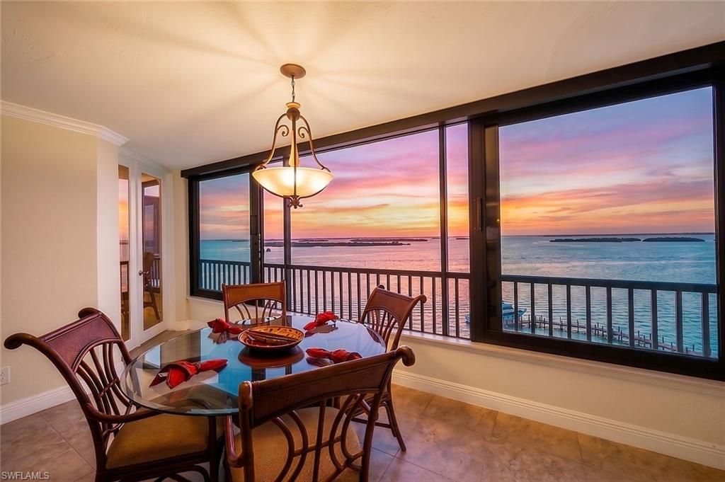 Outstanding bay views await from this near-penthouse, 11th-floor residence, offering unobstructed vistas of San Carlos Bay and Pine Island Sound. This exceptional waterfront condominium showcases spectacular sunsets and panoramic water views from nearly every room.

The spacious primary suite features a comfortable sitting area and direct access to the enclosed sunroom, creating the perfect place to relax while overlooking the shimmering waters. Beautifully appointed throughout, the residence offers luxurious finishes including tile flooring, rich wood cabinetry, striking onyx countertops and backsplash in the kitchen, stainless steel appliances, a dual-drawer Fisher & Paykel dishwasher, and an elegant tray ceiling that enhances the space.

Both the primary and guest bathrooms feature custom-painted cabinetry and marble countertops, adding timeless sophistication. The expanded floor plan includes a thoughtfully enclosed former lanai with sliding windows, screens, and custom motorized sunshades, providing year-round enjoyment of the breathtaking views.

Offered fully furnished, the home is tastefully decorated with rich colors and distinctive accent pieces. The guest suite includes a built-in Murphy bed and custom entertainment center with shelving, maximizing both functionality and style.

Recent updates include a new air conditioning system and hot water heater, offering added peace of mind. Additional conveniences include a premier assigned covered parking space adjacent to the lobby and a private storage area.

Punta Rassa continues to invest in the community with new landscaping scheduled for July 2026, parking area resurfacing planned in the coming months, completed walkways, and newly refreshed tennis and pickleball courts for residents to enjoy.

Ideally situated adjacent to the Sanibel Harbour Yacht Club and the Sanibel Harbour Marriott Resort & Spa, residents enjoy convenient access to waterfront dining, a full-service marina, and the gateway to Sanibel and Captiva Islands.

This is an exceptional opportunity to own a coveted high-floor residence with covered assigned parking at Punta Rassa, where breathtaking views, luxurious finishes, and an unmatched waterfront location come together to offer the very best of Southwest Florida living.
