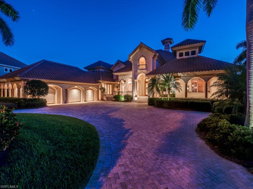 This classic & elegant home, located in the most desirable neighborhood of Spring Ridge, was built by Harwick Homes in 2003.  An estate home offering the ultimate in Florida lifestyle from the moment you enter from the oversized circular drive.  Walking in, you see the beautiful living room w/ detailed stonework, ceiling and molding treatment, fireplace & beyond the lush tropical pool, spa & outdoor living areas overlooking lovely south golf views.  A very spacious great room has a large walk behind bar & flows beautifully together by pocketing sliders to the entertaining area off the lanai w/ fireplace and seating area, as well as, an outdoor kitchen.  The gourmet kitchen is located in the heart of the home.  A stunning & spacious master suite has amazing views and includes a luxurious master bath.  Three spacious en suite guest rooms which include a morning kitchen for guests and private balcony overlooking the pool & golf course.  Handsome study with library size built-in’s.  Other fine amenities include lite touch system, surround sound system throughout, wonderful storage spaces, plantation shutters, complete hurricane protection, oversized 3 car garage and so much more.