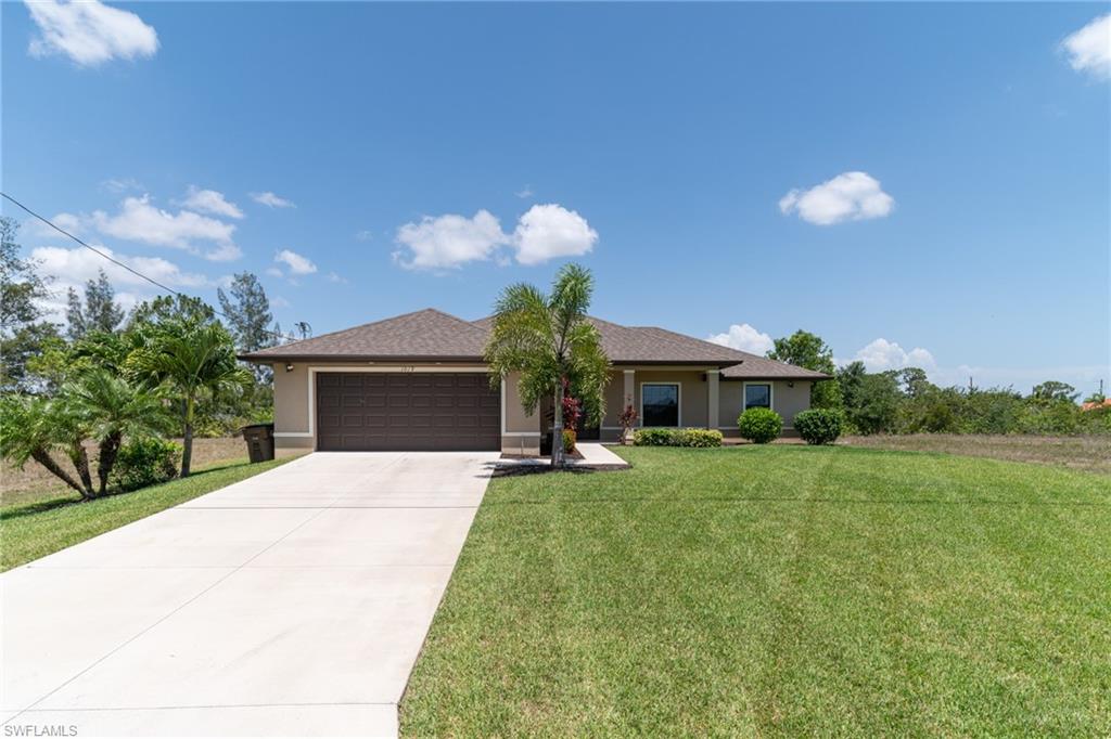 Picture yourself enjoying the sweetness of SWFL living at it's finest in this beautiful Bonita model that boasts 3 bedrooms, 2 baths, and a 2 car garage. This pool home overlooks the wide freshwater Asa canal that goes for 7 miles. The seawall is already there. A nice beautiful granite breakfast bar to serve your family and the lay out is  split bedroom floor plan.  This home has only had two owners who have kept it meticulously maintained and upgraded, with Plantation Shutters, extra zones on the water sprinkler system, a whole house reverse osmosis system, recently flushed out septic system, new outdoor lights, and you will have a newer well pump, mature and beautifully maintained landscaping.  Trees include avocado and lemon. Enjoy a  fresh squeezed lemonade while you lounge by the pool.  The mounted TV will stay for your entertainment pleasure.  The outdoor ceiling fan will keep you cool while outside of the pool.  Outdoor shower for your convenience. Ceiling fans throughout the house. You have no front, back, or neighbors on either side of you. Washer and dryer convey.