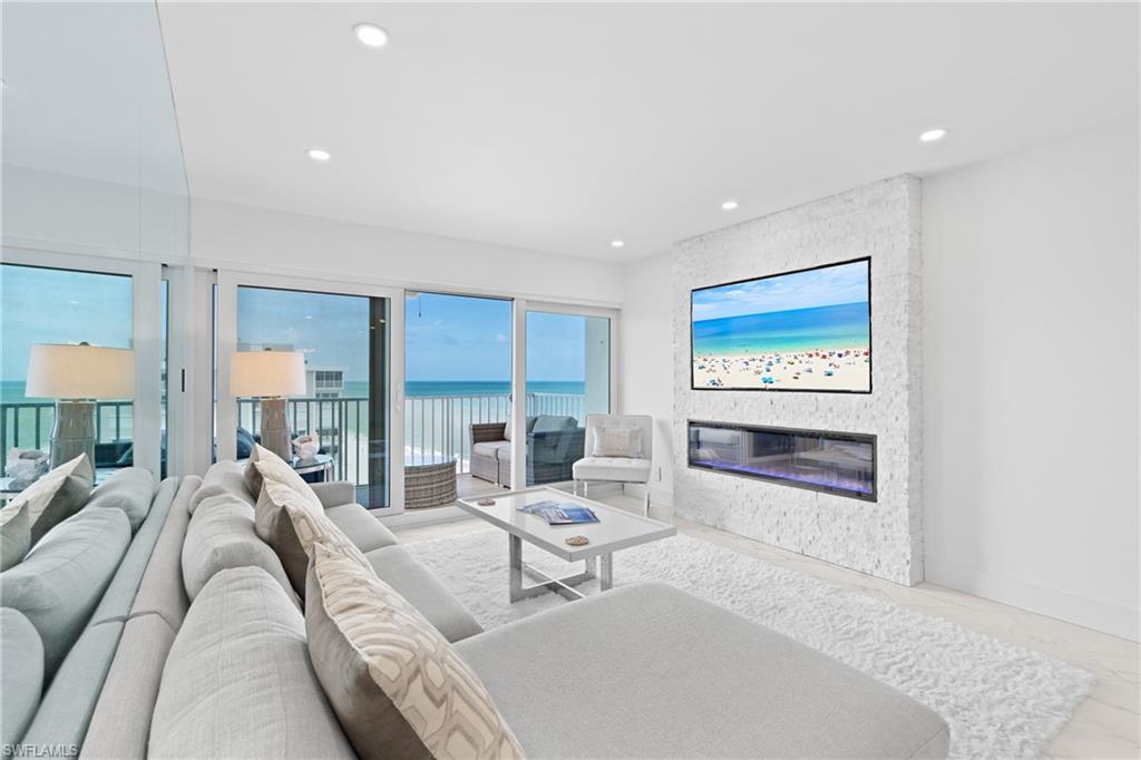 Top-floor beachfront living at the Naples Continental Club in the Moorings. This beautifully remodeled 2BR/2BA residence (1,215 sq ft) crowns the 8th floor with coveted southwestern exposure — uninterrupted Gulf of Mexico and beach views with front-row sunsets from the living area, primary suite, and private balcony. Crisp contemporary renovation featuring Italian porcelain tile throughout, an open-concept layout, and a chef's kitchen with premium Fisher & Paykel appliances. King bed in the primary suite, queen in the guest room. Assigned covered carport parking included; laundry facilities in the building. The building completed a top-to-bottom amenity renovation in 2024: resort-style beachfront pool, reimagined courtyard, fitness center, modernized lobby, club room, library, and shuffleboard — all just an elevator ride from the sand on Moorings Beach. Walk to Venetian Village; minutes to Waterside Shops and the dining and galleries of 5th Avenue South. 30-day minimum per association. Professionally managed by Naples Vacation Properties