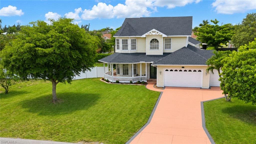 Presenting 3426 SW 7th Lane, a Gorgeous Victorian-Inspired, Key West Pool Home in SW Cape Coral! This Stunning, One-Of-A-Kind Property Combines Traditional Elegance w/Modern Convenience Creating Seamless Transitions Throughout This Fairytale 0.38 Acre Oasis.
Exceptional Indoor Upgrades Include: Custom Kitchen Cabinetry; Italian Mosaic Backsplash; Nostalgic ILVE Gas Range; Sage Green-Veined Granite Counters & Island w/Breakfast Bar & Stools; Matte Tile Flooring & Interior Paint (2024); Oversized Laundry with W/D, Sink, Storage & Built-In Ironing Board; Wainscoting, Crown Molding & Plantation Shutters Throughout; Window Seat w/Under Bench Storage; Kitchen Pantry Built-Ins; Additional Understairs Storage Space; Central Vac; Designer 1st Floor Chandeliers; 2 Primary Bedrooms w/Double Vanity, Ensuite Baths; 1st Primary Suite Features a Circular Sitting Area, Walkin-Closet w/Built-Ins & Safe; Separate Shower & Garden Tub; 2nd Primary Bath Features Oversized Walk-In Shower w/Mosaic Tiles & Bench Seat, a Rainfall Shower Head w/Five Wall Jets; Carpeted Upstairs (2025); Hardwood Floor Staircase & Grandfather Clock That Conveys & Unarmed ADT System w/2 Cameras.
Outdoor Highlights Include: Oversized Triple Lot Site; New Roof (2022); 2 Car + Golf Cart Garage w/Workbenches & Overhead Loft Storage; Compressor, Hose Reels, Garage Fridge & 100 Gallon Propane Tank That Convey; Sprinkler System That Uses On-Site Water From a Deep Well; City/Water Sewer Services w/Paid Assessments; Stunning Heated, Salt-Water Pool w/Waterfall, Resurfaced (2025); 1st Floor Storm Shutters; Freshly Painted Stamped Concrete Driveway; Lovely Wrap Around Porch; Storybook Outdoor Pergola Sitting Area & 10x20 Workshop/Shed w/2 Upper Storage Lofts, 2 Windows, 6 Ft Doors, Ramp & Electricity; Beautifully Maintained Lawns & Mature Landscaping Completely Enclosed By 12 Ft Tall Fencing For Ultimate Privacy. Just Steps Away from Joe Stonis Park. A Definite Must-See! Please Schedule Your Private Showing Today!