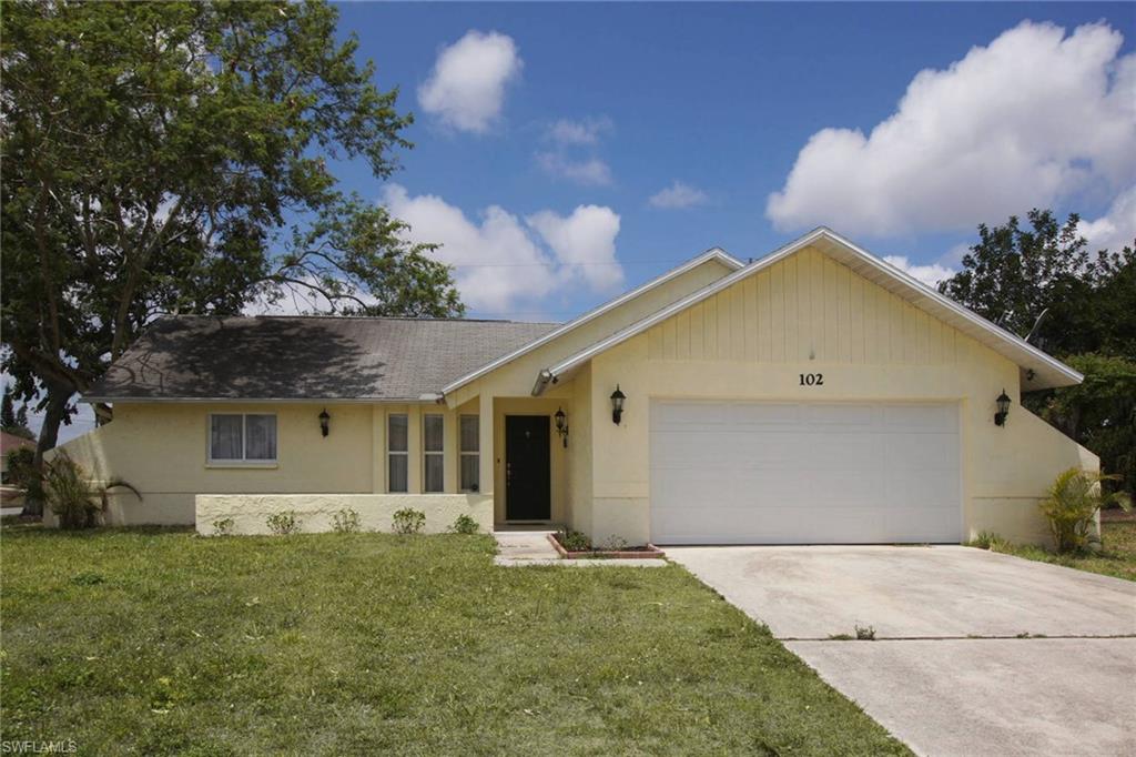 Fantastic 3-bedroom starter home sits on a corner lot and has over 1,100 square feet under air.  The great room is open to the modernized kitchen with two-toned gray and white cabinets and marble countertops.  The master bedroom is separate from the other 2 bedrooms.  The master bathroom has been remodeled with floor to ceiling tile and a must-see shower which gives you the illusion of outdoor living.  The screened lanai overlooks the fenced in back yard. The plumbing has been redone in the home in 2014 and it is on city water and sewer. Its location is ideal as shopping, dining and grocery stores are all nearby.