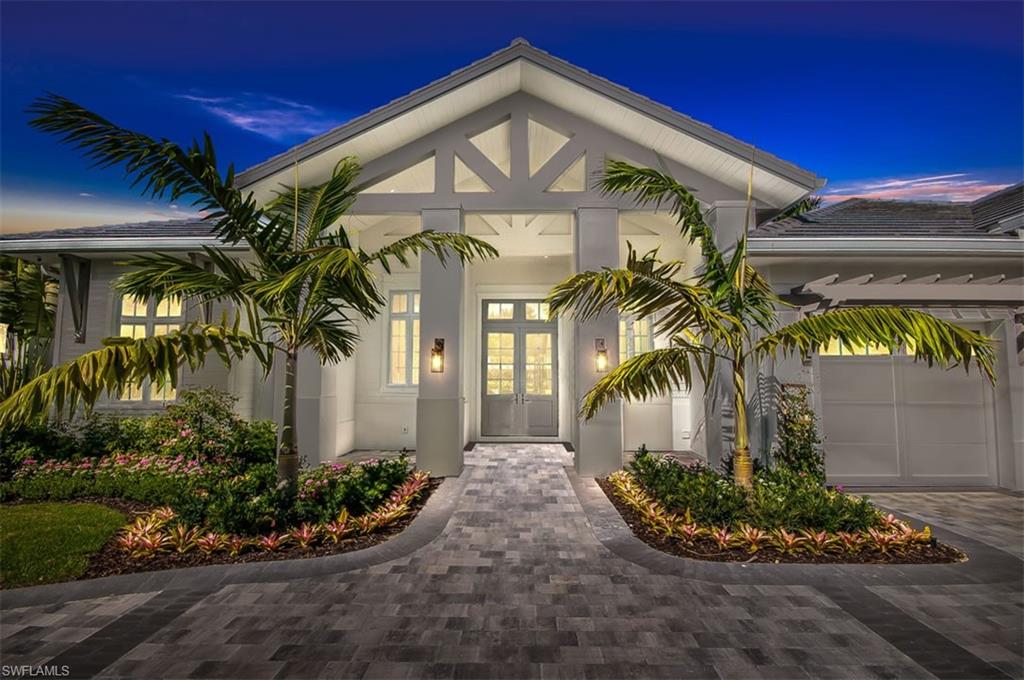 PANORAMIC GOLF COURSE VIEW. One-story luxury custom home located on a very quiet street with breathtaking water and golf views. The home, is fully furnished, has been professionally decorated with taste and includes four full bedrooms, large study, four full baths, two and half baths and three car garages. The open floor plan will flow seamlessly to the tastefully designed outdoor living area with gas-heated pool and spa featuring waterfalls and theatrical fire bowls, summer kitchen, wood-burning fireplace and outdoor shower. The large, epicurean kitchen has custom cabinets, Sub-Zero/Wolf/Bosh appliances with a very large center island, and over-sized pantry. Home is filled with very high-end finishes including wide plank wood flooring throughout, Automated Smart Home, retractable screens and shutters. Conveniently located, just minutes to the beach and downtown Old Naples, Venetian Village, and Waterside Shoppes. Owner will have access to the Moorings private beach park.
