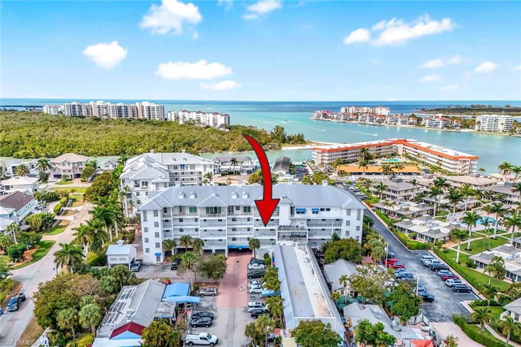 Discover a rare investment opportunity at Olde Marco Inn - Unit 208, a beautifully updated 2-bedroom, 2-bath condo located in the highly desirable historic Olde Marco district of Marco Island. With daily rentals permitted--an uncommon feature on the island--this property offers exceptional income potential combined with personal use flexibility. Boasting a strong rental history, this turnkey residence allows owners to generate immediate income while enjoying their own island getaway. Owners have the option to self-manage or utilize the on-site rental program for a more hands-off approach. The condo has been thoughtfully updated and tastefully furnished, featuring a modern kitchen with white shaker cabinets and stainless-steel appliances, renovated bathrooms, plantation shutters, and new furnishings throughout. Major improvements include impact-resistant windows, a new HVAC system (2023), and water heater (2023). An oversized screened lanai, also accessible from the owner's suite, provides a relaxing space for guests to enjoy the island breeze--an attractive feature for vacation renters. Located in the heart of historic Olde Marco, enjoy live music, boutique shops, galleries, and restaurants right at your doorstep. Waterfront dining at the iconic Snook Inn is just steps away, and an easy golf cart or bike ride takes you to Marco Island's famous six miles of white sand beaches. As an added benefit, property ownership on Marco Island provides eligibility for a Resident Beach Pass, offering exclusive beach access for owners. Community amenities include a pool and spa, further enhancing guest experience and rental appeal. Whether you're looking to expand your investment portfolio or secure a personal retreat with income potential, this property delivers the ideal combination of location, flexibility, and return.