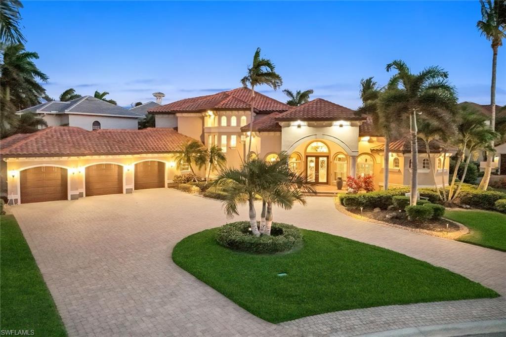 DIRECT GULF ACCESS | SOUTHWESTERN REAR EXPOSURE | ESTATE LIVING IN CAPE HARBOUR
BOATING, SUN, SPACE—and a home that actually lives up to it. Located in Harbour Preserve (Gate 3) within Cape Harbour, this custom estate by Aubuchon Homes sits on nearly 1/2 ACRE and offers quick access to the Gulf, complete with a 20,000 lb BOAT LIFT, wraparound COMPOSITE DOCK, and JET SKI LIFT.
The outdoor space is a standout. With highly desirable SW REAR EXPOSURE, the expansive lanai is built for sun-filled days and incredible evenings, featuring a heated resort-style pool and spa, sun shelf, in-water bar table, tiki hut, summer kitchen, and multiple covered areas for dining and relaxing. Lush landscaping, updated lighting, and a rare amount of green space create a true backyard setting—PERFECT FOR PET OWNERS who want room for their dogs to actually run.
Inside, over 5,000 sq ft of living space showcases high-end finishes throughout. The open great room offers coffered ceilings, a gas fireplace, and seamless indoor-outdoor flow through large sliders. The kitchen is designed for both everyday living and entertaining with granite countertops, gas range, custom wood cabinetry, prep island with sink, SS appliances, large walk-in pantry, and built-in coffee system.
The first-floor primary suite is a private retreat with French doors to the lanai, a built-in coffee/wet bar area, oversized custom walk-in closet, and a luxurious bath with dual vanities, makeup area, soaking tub, and a walk-through shower with multiple heads. A second primary suite upstairs with its own screened balcony offers ideal space for guests or extended stays.
All five bedrooms are ensuite, providing comfort and privacy throughout. A spacious club room on the main level adds another layer of living and entertaining space with a full wet bar, wine room, and game area, with direct access to the lanai.
Offered TURNKEY (with limited exclusions) and including a golf cart, this home is well-suited as a full-time residence or a high-end seasonal retreat. Impact windows and doors and a buried propane system support both comfort and peace of mind.
Located in one of Cape Coral’s premier gated waterfront communities offering marina-front dining, shopping, and live entertainment—just moments from your home.
HOMES WITH THIS COMBINATION OF LOT SIZE, BOATING ACCESS, SW REAR EXPOSURE, AND LIVABLE LUXURY RARELY COME AVAILABLE—THIS IS YOUR OPPORTUNITY TO SECURE IT!