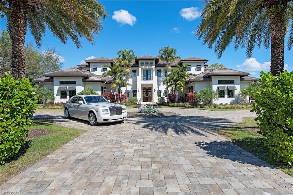 H5118  Indulge in the life of luxury and leisure most people only dare to dream of. This one-of-a-kind home offers unparalleled elegance and stands proud on a premium one-acre lakefront lot within an exclusive pocket of Naples. Not a single detail has been overlooked or expense spared in the creation of this 2016-built custom home that truly must be seen to be believed. The light-filled and spacious floorplan has been masterfully created for absolute privacy and opulence with four bedrooms, six bathrooms, and a den. A selection of gathering spaces await including a living room, dining room, a game room, and a theater with state-of-the-art surround sound. Cooking will be a dream in the flawless chef’s kitchen with Wolf and Sub-Zero appliances, Kohler fixtures, and stone countertops before moving outside to relax on the covered patio and admire the lake views. The breathtaking list of extra features includes a sparkling pool, an elevator, a split four-car garage, and an Electrolux central vac and sweep system. All this is set on a sprawling lot with manicured gardens, a lush lawn, and easy access to shopping, golf courses, schools, and the beach.