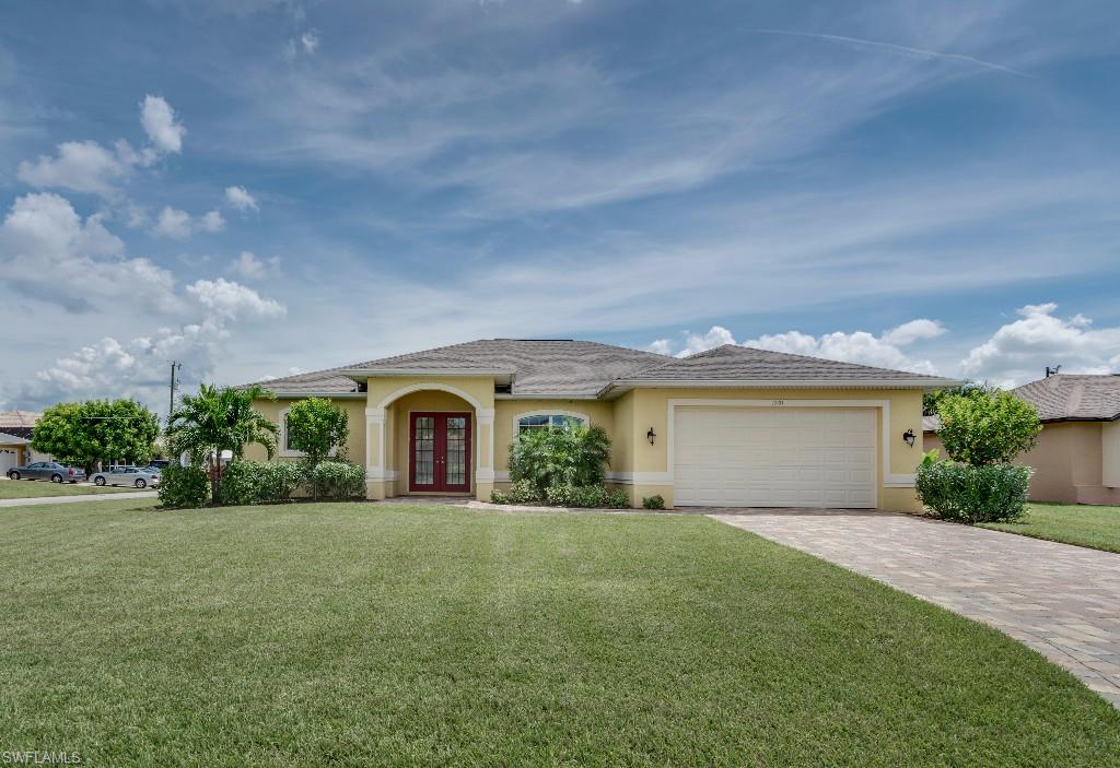 Like new corner location surrounded by gulf access homes.  Double door entry, tile throughout, lush landscaping, brick paver drive & pool plus large screened lanai with summer kitchen.  Interior has upgraded level three & four granite in kitchen & baths, upgraded cabinets, breakfast bar, large walk-in closets in all bedrooms, separate tub & shower in the master.  High elevation with 8' doors make this home very appealing.  Plant shelves, tray ceilings, 6' baseboards & more.  All assessments paid!