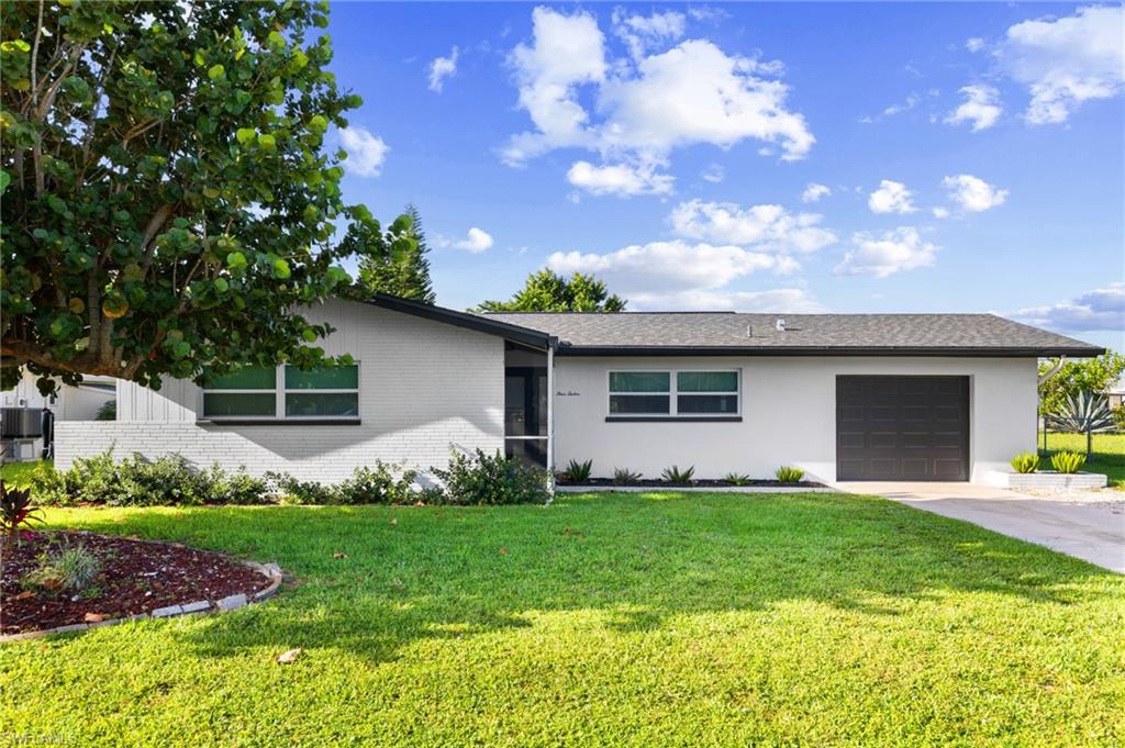 Presenting an exceptional residential opportunity at 412 El Dorado Parkway East. Situated in the highly desirable Southeast quadrant of Cape Coral, this comprehensively remodeled, open-concept residence provides an abundance of versatile living space. The property encompasses 3 bedrooms and 2 bathrooms across 1,658 square feet of refined interior. Located within a prestigious neighborhood that maintains the impeccable standards of an association-managed community without the associated fees or restrictions, this property is offered with all assessments paid in full.

The residence is thoughtfully designed to maximize natural light, establishing a bright and inviting interior environment. The well-appointed kitchen features 42-inch cabinetry, continuous quartz countertops, and a full suite of stainless steel appliances. Ideal for hosting, the kitchen includes a substantial breakfast bar accommodating seating for five. Above the sink, a large window frames the tropical landscape, offering abundant natural light, canal views, and views of local dog walkers and joggers during daily routines. Premium interior finishes include Luxury Vinyl Plank floors, high-efficiency impact windows, and extensive recessed lighting. A washer and dryer are also included with the property.

Significant capital improvements provide long-term reliability and operational efficiency. The home is equipped with a newly installed HVAC system and a new hot water heater, both updated in 2024. Furthermore, the property benefits from entirely new plumbing systems and is fully prepped for modern connectivity with fiber optic internet access.

The exterior grounds feature an expansive lanai and a fully fenced perimeter. The south-facing lot offers ample dimensions to accommodate the addition of a custom pool. Situated on a non-through section of El Dorado Parkway East, the property benefits from a tranquil, low-traffic streetscape enhanced by mature tropical landscaping. The location supports a highly walkable and golf-cart-friendly lifestyle, offering convenient access to the shopping, dining, and entertainment venues of downtown Cape Coral. Residents are moments away from the city's sole beach and the Yacht Club, which provides public amenities including a boat ramp, docks, a fishing pier, tennis facilities, a swimming pool, and year-round community festivals.

This property represents a compelling investment with substantial future upside. The adjacent Cape Coral Yacht Club is currently undergoing a comprehensive $225 million redevelopment project, slated to introduce a new community center, a resort-style pool, a waterfront dining establishment, and an upgraded marina. Additionally, the home is located mere minutes from notable new developments, including The Cove at 47th, Bimini Square, and Slipaway Marina, positioning it strategically at the center of Cape Coral’s ongoing civic transformation.