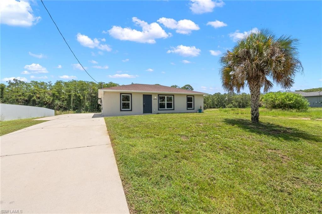 Well-maintained 3-bedroom, 2-bathroom concrete block home built in 2018 and situated on a scenic pond in Port LaBelle. This move-in-ready residence features hurricane impact windows, a 30-year dimensional shingle roof, energy-efficient A/C and water heater, solid core exterior doors, and an open floor plan with a vaulted ceiling in the great room. The kitchen is equipped with black Whirlpool appliances, custom shaker-style espresso maple cabinetry  and granite countertops. Outside, the extra-wide concrete driveway provides ample parking, while the oversized rear concrete patio offers plenty of space for outdoor entertaining and enjoying the peaceful pond views. The backyard overlooks a bass-filled pond bordered by a natural Florida cypress head, creating a beautiful and private setting. Enjoy fishing right from your own backyard while taking in stunning Florida sunsets.  Located in a desirable East LaBelle setting, this property offers the freedom of no HOA and the added benefit of no flood insurance required. Combining modern construction, quality finishes, and tranquil outdoor living, this home is ready for its next owner to enjoy.