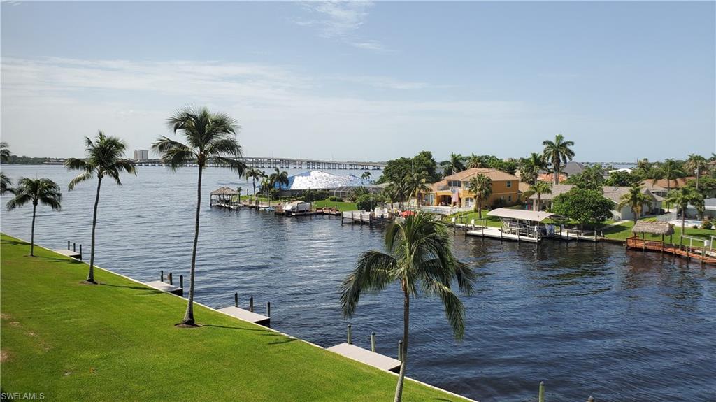 Let your imagination take you away with the potential of what can be done in this 4th floor 2/2 condo in River Towers! Overlooking the Caloosahachee and intersecting canals, this condo comes already demo'd and ready for a new owner to give it a new fabulous look! Enjoy beautiful sunrises and sunsets as well as dolphins swimming by from your screened balcony. In-condo laundry utility room. Windows in kitchen and bedrooms are impact rated! River Towers is located in a cul-de-sac just steps away from Jaycee Park and easy access to downtown Cape Coral and both bridges to Fort Myers. The development offers a beautiful riverfront heated pool and tiki hut, shuffleboard, 2 community rooms, library, large over sized storage unit, reserved parking spot, fishing dock and a few options for boating. Boat slips are handled directly through the HOA. Large almost 10x10 storage units, 1 reserved parking and plenty of guest parking. 55+ development, no pets, no smoking, no rentals for the 1st 3 years of ownership. Call today if this kind of project is what you are looking for! Agents, please see confidential remarks.