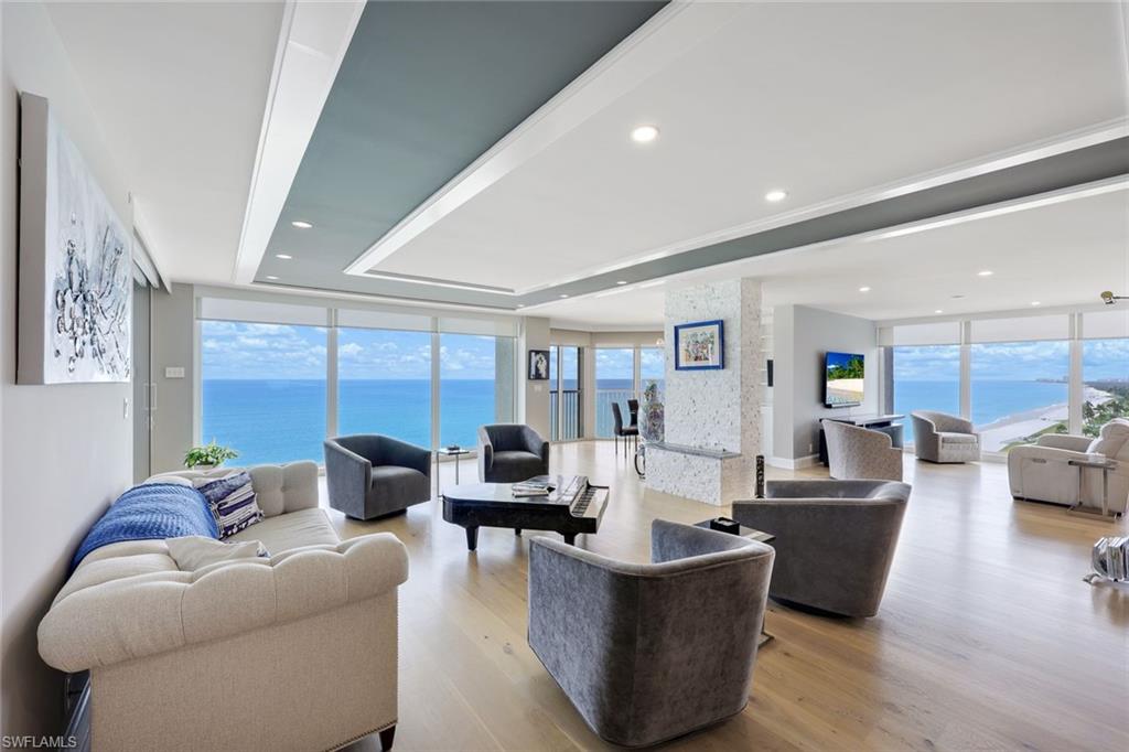 Stunning Gulf of Mexico views from every room in this beautifully appointed three bedroom, three bath residence, with numerous improvements to the floor-plan, design, fixtures and decor. Must see to appreciate all that this "sky home" has to offer. Included is an open modern chef's kitchen with large entertaining island, custom built-ins in the front entry, storage added throughout the residence, and an efficient, in-unit laundry room. Wide plank White oak flooring is found in the main living areas, and in the entry area there is a beautiful decorative inlaid tile border. The meticulous owner's have updated all three baths, doors, hardware, and added a stacked stone fire-place feature in the living room. Plenty of room for entertaining in this home. The Great Room floor plan allows for a variety of living space options, such as a family room, breakfast room, library, game area, whatever you need the space for. Each of the three bedrooms is en-suite for you and your guests privacy. Just a few of the La Mer amenities include a beachside pool and spa, direct beach access, updated fitness center, 3 guest suites, and rooftop observation terrace.  Extra storage is close by on the same level as the residence. La Mer is situated right on the Gulf beach, and with the added bonus of having the residents Park Shore Beach access next door, for added green space and tree tops/garden views. Exceptional shopping & dining just steps away. 24 hour security.