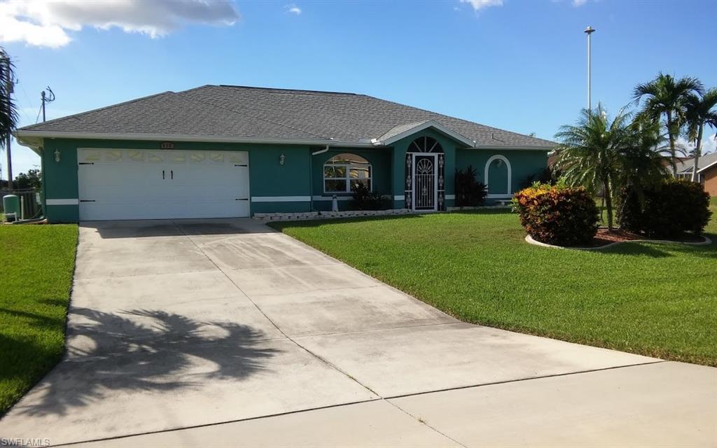 Fantastic home in an established southwest Cape Coral neighborhood! Enjoy the gorgeous Florida sunsets from this west exposure home. This home has three bedrooms and two bathrooms. All bedrooms have walk-in closets and laminate flooring. Master bedroom features pocket sliders leading out to the screened in lanai & pool area. Master bath has a separate shower and Jacuzzi soaking tub and double sinks. The guest bath also serves as a pool bath. The pool is equipped with a solar heater. There is another pocket slider leading from the formal dining and living room to the lanai to give you that open airy feeling. The laundry room has a utility sink and storage cabinets. Home has manual hurricane shutters for all windows and doors and accordion shutters on the lanai. This home has split bedrooms for privacy, and tile flooring throughout the kitchen and family room. There is also a workbench and cabinets in the garage. This is truly a move-in ready house. Make your appointment to see it now – it won’t last long!