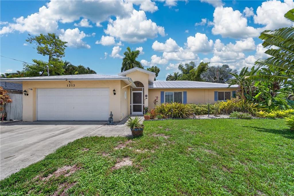 Heated Saltwater Pool | No Flood Zone | New Metal Roof (2023)

Enjoy the Florida lifestyle in this beautifully UPDATED 3-bedroom, 2-bath, split-bedroom POOL home with a 2-car garage, ideally located in the heart of Cape Coral. Situated on city WATER AND SEWER and NOT IN A FLOOD ZONE, this home offers peace of mind along with exceptional value.

The screened lanai showcases a HEATED SALTWATER POOL with a waterfall feature, outdoor shower, and desirable SOUTHERN EXPOSURE providing sunshine on the pool throughout the day. Lush tropical landscaping surrounds the backyard, creating a private, park-like setting perfect for relaxing or entertaining.

Inside, you’ll find soaring cathedral ceilings and luxury vinyl plank flooring installed in 2025, along with tasteful updates to both the kitchen and bathrooms. The open split-bedroom floor plan offers comfortable living with plenty of natural light.

Additional highlights include a new METAL ROOF installed in 2023 and a central location just minutes from restaurants, shopping, and the Midpoint Bridge, making commuting to Fort Myers quick and convenient.

This move-in-ready pool home combines modern updates, privacy, and an outstanding location—don’t miss your opportunity to make it yours!