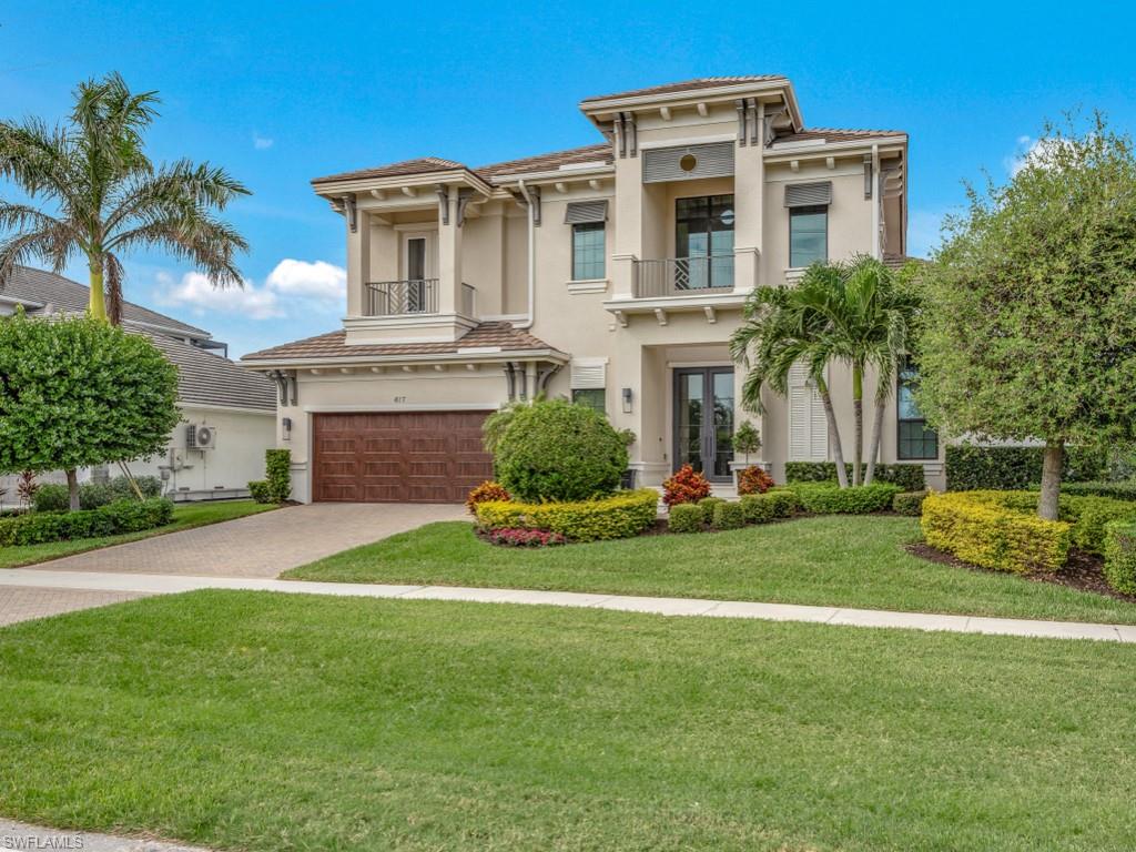 Step into unparalleled elegance with this stunning 5-bedroom, 5-bathroom luxury residence, a former Stock Builders model home that perfectly combines sophistication and comfort. Situated on a water direct lot just down the road from the Tigertail Beach entrance at Marco Island, you’ll enjoy effortless access to the beaches of pristine Gulf of Mexico, making this home a true coastal retreat. Designed with a modern great room floor plan, the open-concept layout creates a seamless flow between spaces, perfect for both entertaining and everyday living. Soaring ceilings throughout the home provide an airy, expansive feel, while oversized windows invite an abundance of natural light and frame picturesque views of the surrounding beauty. The home’s finishes and details reflect meticulous craftsmanship, with premium materials and thoughtful touches in every corner. The lush tropical outdoor area is a true paradise, featuring a spacious living area, outdoor kitchen, a magnificent pool with spa & relaxing sun shelf.  This space is equipped with an advanced outdoor insect control misting system, ensuring a comfortable experience.  For boating enthusiasts, this property is a dream come true. The spacious dock includes two lifts (20,000# & 7,000#) offering direct water access with no bridges out by boat for endless days of adventure on the Gulf.  This luxury home showcases fine features & design elements, blending timeless luxury with modern conveniences. Located in one of the most sought-after neighborhoods near Tigertail Beach, this home offers an unmatched lifestyle of elegance, relaxation, & coastal charm. Experience the epitome of luxury living in this breathtaking home!