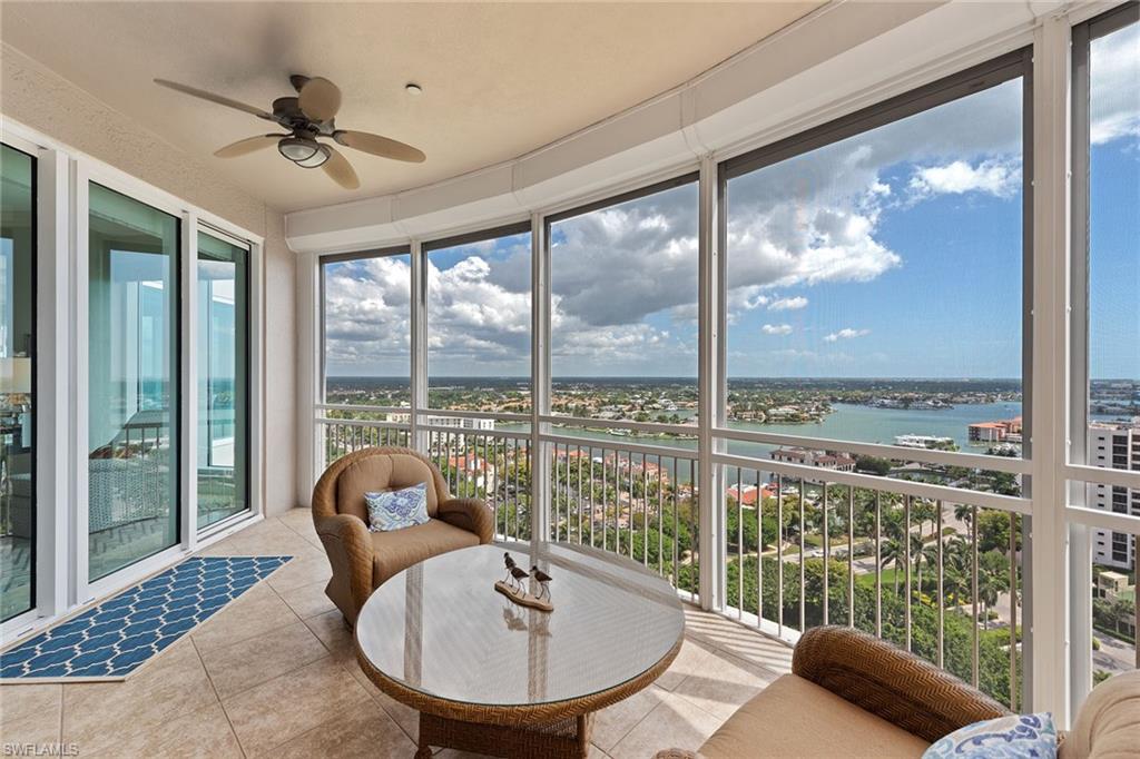 Stunning panoramic views await you in this 19th-floor renovated home at Provence. Wake up to the colorful sunrise, watch the boats on Venetian Bay or gaze at the beautiful sunset over the Gulf all from the comfort of your home. Two screened-in terraces, floor-to-ceiling windows, three en-suite baths, inlaid marble tile and stunning custom light fixtures are just some of the unique features. The kitchen is open to enjoy more expansive views and boasts quartz countertops, modern cabinetry, Wolf induction cooktop, Sub-Zero and KitchenAid appliances. Located directly on the beach, Provence is the epitome of luxury living with a spectacular pool and spa, outdoor kitchen, community and board rooms. For a more active lifestyle, there is a fitness center, tennis court and the Park Shore promenade, a private 1.3-mile paved path to stroll along the beach. Have peace of mind with two under-building parking spaces, a 24-hour lobby and on-site management. Provence is pet-friendly and permitted without size restrictions. Just across the street, enjoy the renowned dining and shopping at Venetian Village, rent a boat from the marina or buy or lease a slip from the yacht club.
