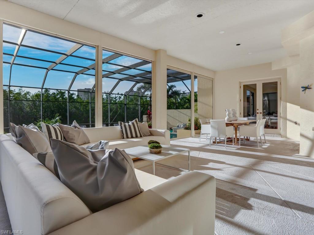 H.11790 - Click Video. Fresh, Sensational and Beautifully Updated, this exquisite Villa in Vizcaya's Best Sunset-viewing Location will captivate and enthrall you immediately! At 2-stories and boasting one of the largest swimming pools on a gorgeous deck, this west-facing Lisbon model showcases outstanding Views of Upper Clam Bay from a spacious outdoor entertaining area and a fabulous Sun-filled Balcony. Your guests can choose from one of two ensuite split bedrooms on the second level, while you enjoy a large ground-floor Master Suite off the Lanai with abundant closet space. Private beach access directly on the Gulf with attended white glove service is part of your membership as is the exclusive Remodeled Bay Colony Beach Club. Privacy, serenity and security are the trademarks of this picturesque Villa neighborhood within the sought-after community of Bay Colony. Further enjoy Pelican Bay’s amenities including two private Beach Restaurants, Fitness center, Tennis Courts, world-class Waterside Shops and Arts Center. Social and Golf Membership opportunities at the magnificent new “Club Pelican Bay” and "Bay Colony Golf Club" complete this relaxed, elegant, superbly Naples lifestyle.