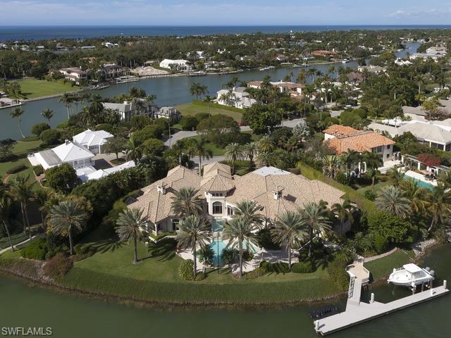 Truly one of a kind masterpiece by Hemmer Williams, Inc. Incredible home with detail only found in the finest properties. Panoramic water views from sweeping 280 degree lot and a half estate. Private 100  foot floating dock plus additional lift and watercraft floating pad. Fully gated and fenced this estate offers privacy and security. Full house automation, video, audio and a full theater. Unique single level floor plan featuring 4 luxury bedroom suites and a 5th suite designed as a private guest quarters with its own kitchen and private entrances. The master bathroom suite includes his and her baths, morning kitchen, dramatic shower looking out to the private orchid gardens and designer closets. Owners retreat just off master bedroom. 1000  bottle climate controlled wine room and full bar are perfect for entertaining. The outdoor space it just exquisite. Dramatic pool with reflecting fountains and a spa. Bridge over the Koi pond leads to the dock. Simply the best of Port Royal.