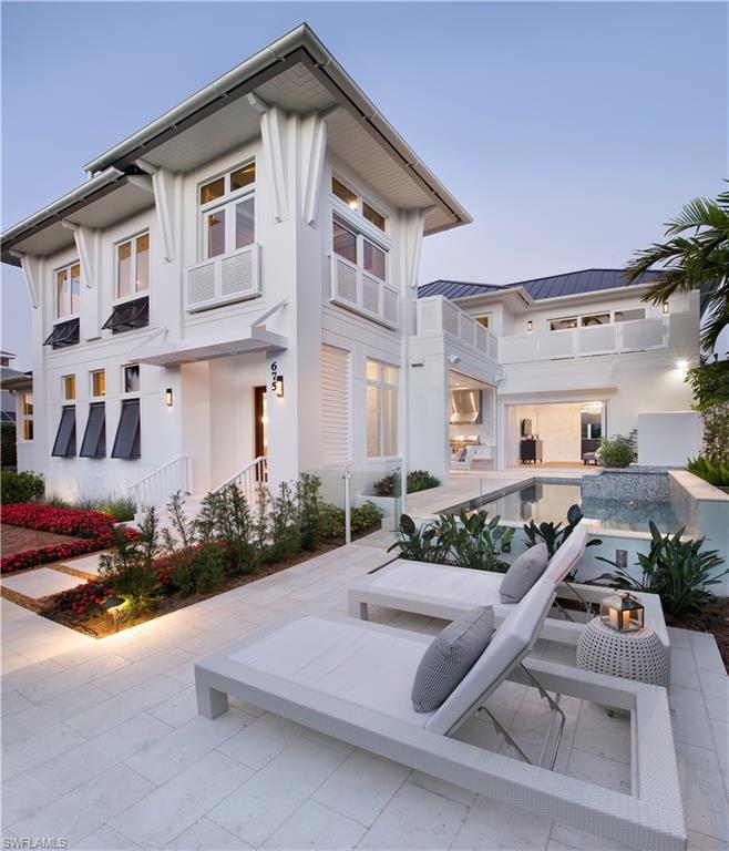 Designed by the well known architectural firm MHK and brought to life by Dreamhouses of Old Naples, this new construction home is a sensational convergence of masterful architecture, exquisite interior design, artful landscaping and copious amenities. This modern beach house, just under 3900 square feet, is offered furnished and is outfitted with a sleek gourmet kitchen, temperature controlled wine vault, white oak wood flooring and glamorous light fixtures. Open the sliding glass doors from the living room and step out to enjoy the magnificent pool deck, cook on the gas grill in the outdoor kitchen or sit by the fireplace and watch the sunset. The chic and on trend first floor master bedroom suite is fully appointed with a stylish spa bath. There are four additional bedroom suites, each with its own distinct personality, on the second level. For your pleasure the Gulf of Mexico is only 1.5 blocks away or stroll down to lively 5th Avenue or 3rd Street to enjoy upscale shopping and restaurants.