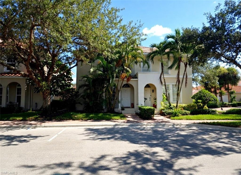 Meticulously Remodeled DiVosta "Aruba" Townhome in Island Walk
Built solid with DiVosta’s renowned strong and durable poured-concrete construction, this meticulously remodeled 3-bedroom, 2.5-bathroom Aruba model townhome lives like a true single-family residence in North Naples' highly coveted Island Walk.

ELEVATED MAIN-LEVEL LIVING
The open floor plan draws you in naturally, with light cascading through premium 3M hurricane-impact sliding doors across rich, large-format tile flooring. The custom kitchen is designed for both entertaining and everyday pleasure, featuring premium Level 3 granite countertops, a timeless marble backsplash, an undermount sink, and a complete stainless steel appliance package.

PRIVATE COURTYARD & DETACHED GARAGE
Step outside the main living area into your ultra-private, screened-in courtyard lanai. This walled oasis is a tranquil retreat perfect for morning coffee or alfresco dining. Room for a pool! The courtyard footprint easily accommodates a custom plunge pool, and with established HOA approval guidelines for this model, upgrading to your own private swim oasis is a breeze. The courtyard seamlessly connects the main house to the detached 2-car garage, which boasts newly polished epoxy flooring.

PRIMARY SUITE WITH PREMIUM VIEWS
Upstairs, luxurious and durable vinyl flooring flows throughout the living spaces. The front-facing primary suite is a true retreat, framing peaceful, elevated views of the community lake and pristine tennis courts right from your windows. The suite features walk-in closets with custom adjustable shelving and a newly renovated en-suite bathroom that exudes the quiet elegance of a boutique hotel. Spotless, turnkey, and completely move-in ready, the home’s mechanicals have been heavily upgraded with a tankless water heater, central vacuum system, and an integrated security system.

THE ISLAND WALK LIFESTYLE (NO ASSESSMENTS!)
This home sits in an absolute sweet spot on Towncenter Circle: close enough to walk to the newly renovated Town Center, but far enough that your street stays quiet and peaceful. Island Walk recently completed a multi-million-dollar renovation of its amenities with ZERO assessments to homeowners. Enjoy miles of scenic walking trails, lap and resort pools, a fitness center, Har-Tru tennis, and pickleball. Island Walk offers unparalleled convenience with an on-site post office, hair salon, gas station, and car wash. Wind down your evenings with dinner and live music at Casa Cotzelli, the community's private Italian restaurant.

UNBEATABLE HOA VALUE
Enjoy a truly maintenance-free Florida lifestyle. Your low HOA fees explicitly cover high-speed internet, cable TV, lawn and landscaping maintenance, automated irrigation water, exterior pest control, and 24-hour guarded gate security. Located in a top-tier school district and just minutes from Naples' world-class beaches, the resort life you've been picturing is ready for you today!