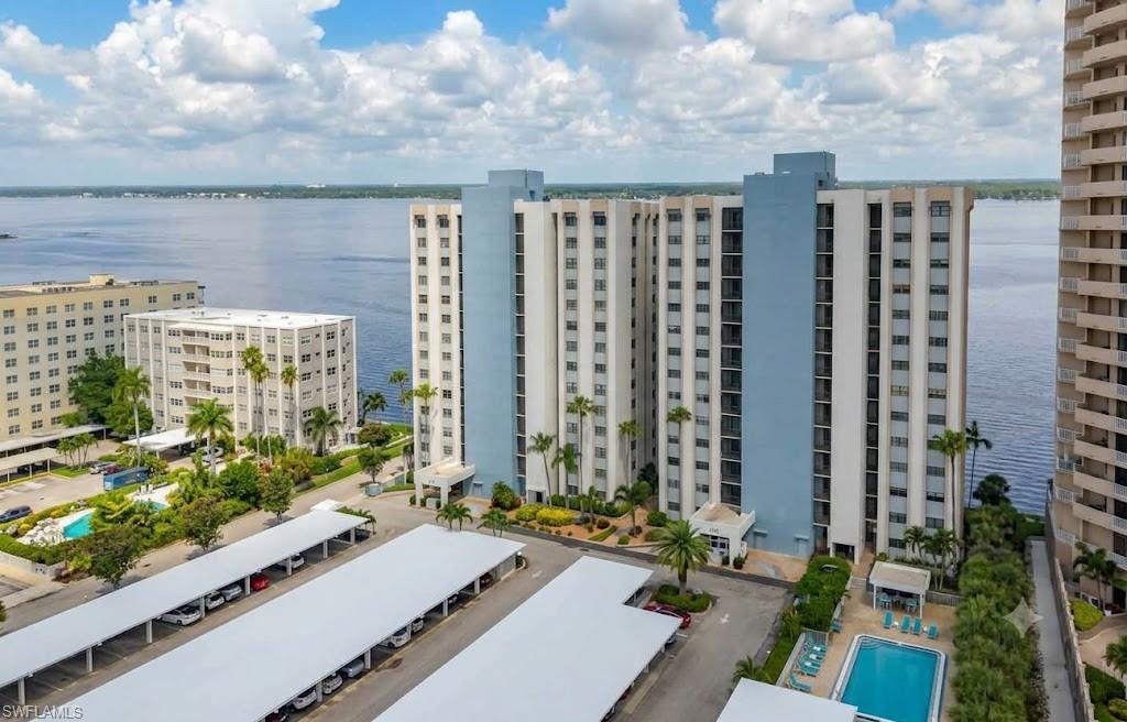 Riverfront Luxury Meets Urban Convenience
Endless River Views & Walkable Urban Living!
Experience the pinnacle of Southwest Florida living in this pristine, 10th-floor riverfront oasis. Perfectly positioned for both relaxation and convenience, this spacious 2-bedroom, 2-bathroom condo offers panoramic, forever views of the Caloosahatchee River. Leave your car in your deeded, covered parking spot—you are just steps away from grocery stores, dining, and the vibrant Historic Downtown River District. 
Inside, an oversized living and dining area serves as the heart of the home, flowing seamlessly through sliding glass doors to a screened lanai equipped with electric hurricane shutters (new 2022). Plantation shutters frame every window, adding a touch of classic coastal elegance. The kitchen is a chef’s delight, featuring warm wood cabinetry, granite countertops, stainless steel appliances, and a convenient breakfast bar for casual dining.
Designed with a split-bedroom floor plan for ultimate privacy, the generous primary suite features a large walk-in closet and access to the screened lanai. The beautifully renovated primary bathroom serves as a private spa, complete with dual sinks, wood cabinets, granite countertops, and a custom-tiled shower with glass doors. Guests will feel right at home in the spacious second bedroom, which also features a walk-in closet. For maximum convenience, the condo includes an in-unit Maytag washer and dryer, tile flooring in all wet areas, plush carpet in the living spaces, and a private storage room located just steps from your front door.
The resort-style community amenities elevate this property to a true lifestyle destination. Lounge by the heated pool and cabana area, host a barbecue at the gas grills, or enjoy a game of pickleball, shuffleboard, corn-hole and horseshoes. Cast a line off the private fishing pier or watch the sunset over the water. Best of all, this pet-friendly community welcomes up to two of your furry companions.!
Desirable in town location, waking distance to grocery store, fine dining and the vibrant Historic River District this condo offers unparalleled balance of waterfront serenity and urban convenance.
Don't just buy a condo—upgrade your lifestyle. Come live the good life on the river!