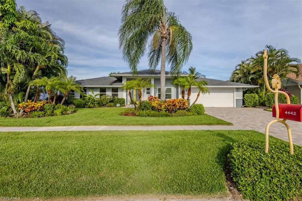 Discover this exceptional lakefront pool home in the highly desirable Pinewoods community, ideally located in the heart of Naples. Thoughtfully expanded and extensively updated, this spacious residence offers 5 bedrooms + Den, 4.5 baths, and a versatile floor plan featuring two private primary suites—perfect for multi-generational living, extended guests, or anyone seeking additional privacy and flexibility. Designed for comfortable everyday living and effortless entertaining, the generous living spaces flow seamlessly to the expansive screened lanai, where you'll enjoy tranquil long lake views, a large pool, and an oversized pool deck—creating the perfect setting to relax, entertain, or simply embrace the Southwest Florida lifestyle. Quality improvements throughout the home provide exceptional value and peace of mind, including a new roof (2017), a second air conditioning system (2017), updated plumbing (2012), impact-resistant windows and doors, and a new front entry door. These thoughtful upgrades enhance comfort, energy efficiency, and storm protection while reflecting the care and maintenance the home has received over the years. Pinewoods is known for its mature tree-lined streets, scenic lakes, and exceptionally low HOA fees. Residents enjoy an unbeatable central Naples location just minutes from Naples' world-famous Gulf beaches, Waterside Shops, Mercato, downtown Naples, top-rated schools, fine dining, shopping, and convenient access to I-75. Adding to its appeal, the property is located in a No Flood Insurance Zone, offering valuable savings and additional peace of mind. Combining generous living space, quality updates, an oversized lakefront homesite, and one of Naples' most sought-after locations, this home presents an outstanding opportunity to enjoy the very best of Naples living.