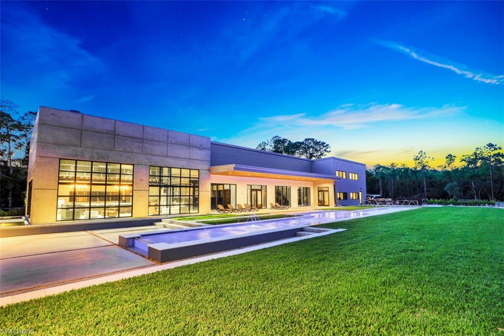 H2082 - A stunning and sophisticated Contemporary Estate on 2.5 acres of land, nearing Final Completion, with meticulous attention to design and detail. This Architectural Masterpiece boasts over 10,000 sq. ft. with 7 Bedrooms and 7 Bathrooms in the main residence and over 2800 sq. ft. with 3 Bedrooms and 2 Bathrooms in the second residence. Stylish living spaces abound between the two, including two beautifully appointed Chef’s Kitchens with Bosch, Southbend and Thermidor appliances, sleek dining and living areas, Home Cinema room, expansive Gym, Office, Lofts, Media Rooms and attached In-Law apartment with elevator access, CR Laurence commercial impact resistant window system, and many more incredible features and high end amenities. Each residence has its own 500 gallon Propane Tank and 20KW Generac Full-House Generator as well.  The seamless indoor/outdoor flow creates inviting spaces for entertaining and resort-style relaxation, including an outdoor kitchen and dining area, and a stunning Saltwater Pool that spans over 143 feet, all while surrounded by lush landscaping and an expansive grassy yard. This is a once-in-a-lifetime opportunity to own this Masterpiece.
