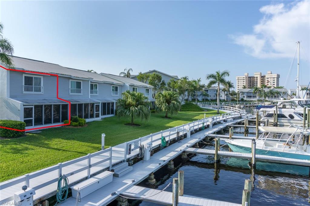 Of all the available townhomes in Boardwalk Caper, this is a great value,  situated in the best location with a DIRECT VIEW of the WATERFRONT and YOUR LARGE DOCK ( 14'6"wide ). This townhome building is the closest and quickest BOATING ACCESS to San Carlos Bay and the Gulf. Enter your home through the large private patio with storage. Covered parking is included. Bike, walk or drive over the sky bridge in a few minutes to Fort Myers Beach on Estero Island. Boardwalk Caper has it all, with 4 pools, tennis courts, basketball and a perfect waterfront setting. End your day with amazing sunsets and frequent sightings of dolphins and manatees in the 200 wide boating canal.