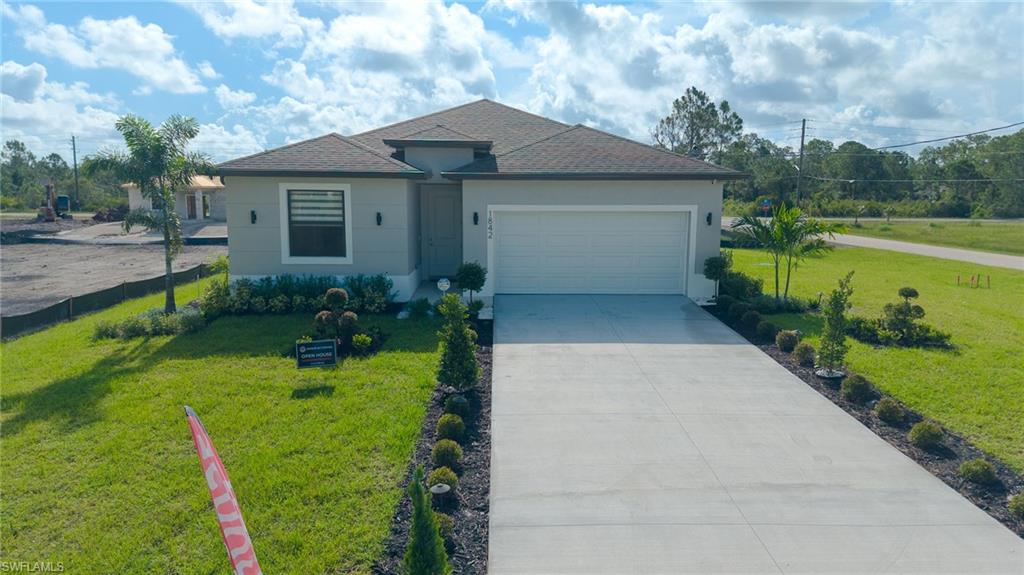 This brand-new, move-in-ready Lehigh Acres home offers 2,227 total square feet (1,715 sq. ft. living space) of modern, open-concept design perfect for families and investors alike. The bright and flexible layout features 4 bedrooms, 3 bathrooms, a 2-car garage, and impact-resistant windows and doors for ultimate peace of mind. At the heart of the home is a chef’s kitchen complete with quartz countertops, a large center island, a wall oven, a cooktop with a pyramid hood, and stainless steel appliances, while the spacious primary suite serves as a private retreat boasting a double vanity and a walk-in glass shower. Backed by a 10-year builder’s warranty, this stunning property sits in a peaceful, growing neighborhood and includes an oversized backyard with endless potential for a future pool or custom outdoor oasis.