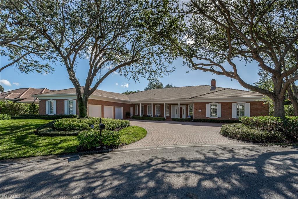 Unique home in desired and prestigious Pelican Bay. This beautiful home is in a highly desired location on a quiet cul-de-sac, with over 5,500 square feet. Large and bright dining/living room with 10 foot ceilings with fireplace.  Well-appointed spacious kitchen with large island, and full-sized pantry. The Kitchen area connects to the family room with built-in cabinets and pool table. Separate corner office with built-in cabinetry and storage that could also serve as a fourth bedroom. Primary suite has two individual baths with double vanities, separate showers and walk- in closets. Two additional guest bedrooms boast full ensuite bathrooms. Bedrooms will comfortably accommodate king-size beds. Out back is a 1000 square foot covered lanai with automatic shade control. The lanai features an outdoor cooking area with sink, min-fridge and gas grill overlooking the landscaped in ground pool. Large laundry/craft room with built-in cabinetry. The home features a fully functioning Generac home generator. This home has never been flooded. Residents of Pelican Bay have access to a variety of resort-style amenities including private beach, dinning, tennis and community center.
