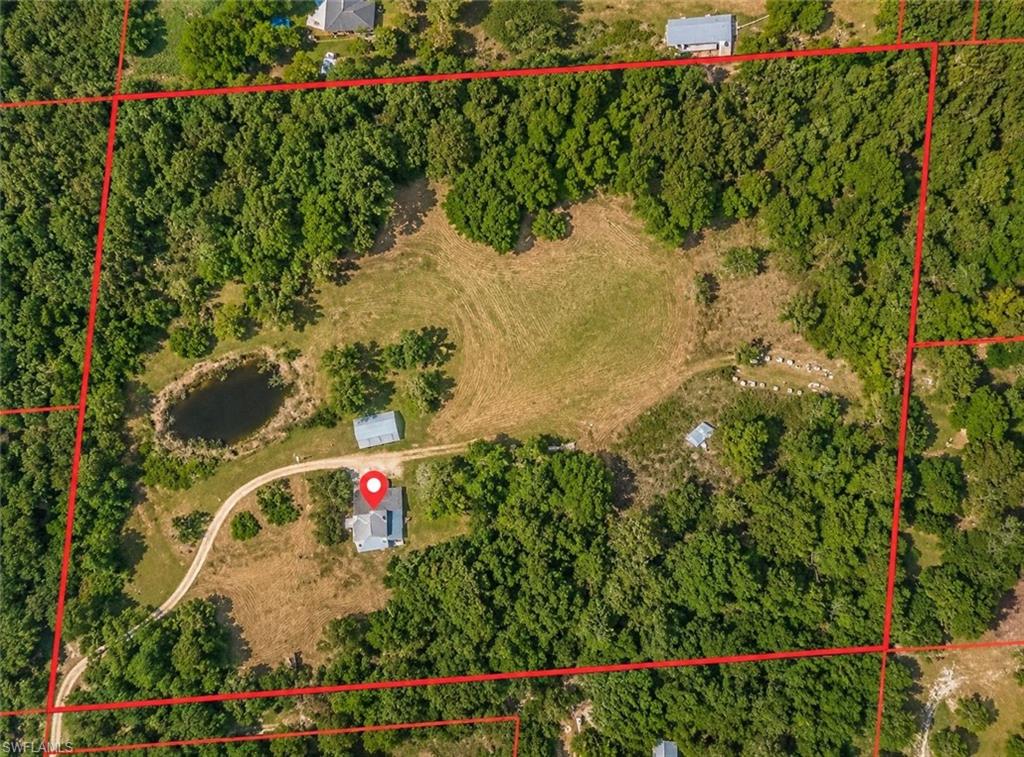 Nestled at the end of a private road, this peaceful 10.41-acre property offers privacy, space, and endless possibilities. With two convenient access points from Donna Drive and Pine Echo Road off Nalle Grade, this unique property is ideal for those seeking room to spread out. The property features a 3-bedroom, 2-bath manufactured home with a covered wooden back porch overlooking the beautiful surroundings. A spacious three-bay garage provides ample storage for vehicles, equipment, or hobbies. Mature oak trees and a pond enhance the natural beauty of the property. Bring your horses, cows, chickens, and other livestock, or create the country retreat you’ve been dreaming of. Whether you’re looking for a homestead, hobby farm, or investment opportunity, this property offers exceptional potential in a private setting.