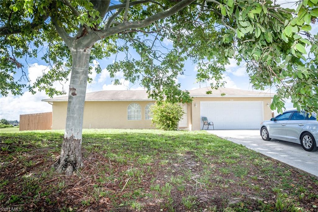 Location, privacy and huge potential! You've found it all with this fabulous and affordable home in one of Cape Coral's most desired areas! this home shows character and style. Get impressed with a wonderful split floor plan, three bedrooms, two bathrooms and two car garage with vaulted ceilings, tile floors throughout except in bedrooms which has carpet, comfortable kitchen, cozy lanai and fence backyard, freshly painted, stucco refinished exterior. Conveniently located near schools, restaurants, shopping and more!  this is one you'll want to see! Great for started home, rental and excellent investment opportunity as well.