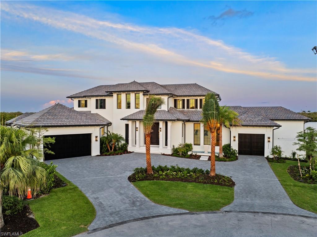 Welcome to an exceptional property located at the end of a peaceful cul-de-sac in the prestigious Royal Harbor community. This new construction home offers breathtaking 180-degree panoramic views of the serene, protected mangroves of Haldeman Creek, with 228 feet of pristine waterfront. A creation of Stofft Cooney Architects, built by Equinox Construction, and designed by Ficarra Design Associates, this residence sets a new standard for luxurious coastal living.  Spanning approximately 6,000 square feet of living space, this home combines architectural brilliance with refined elegance. Inside, you’ll find five spacious bedrooms with en suite bathrooms, and one half bath. The interior includes a large great room, stylish club room, a gourmet kitchen with custom cabinetry and prep kitchen, wine coolers, private elevator and wood floors throughout. Every detail, from the layout to the finishes, has been meticulously curated to provide both comfort and sophistication.  The outdoor living experience is thoughtfully designed to maximize relaxation and entertainment, the property features abundant covered and open-air spaces, including a large living area with a fireplace, an infinity-edge pool, an outdoor summer kitchen, and a fire pit. Electric roll-down screens and shutters allow for seamless indoor-outdoor living while maintaining privacy and comfort.  For boating enthusiasts, this home is a dream come true. With direct, no-bridge access to the Gulf of Mexico, a private boat dock, and a 30,000-pound lift, your waterfront adventures await. Whether it’s a sunset cruise or a day on the water, this property offers unparalleled access to the beauty of coastal living.  Equipped with state-of-the-art home automation, Lutron lighting, and a whole-house generator, this residence blends cutting-edge technology with timeless elegance. Each room has been designed to showcase stunning water views, creating an atmosphere of tranquility. This is more than a home; it’s a rare opportunity to own a masterpiece in one of the most sought-after locations in Royal Harbor. Experience luxury living with unmatched style, comfort, and views.