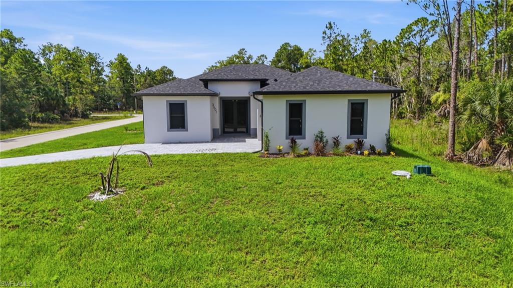 **SELLER IS OFFERING $10,000 TOWARD BUYER'S CLOSING COSTS!** Experience modern living in this newly constructed 3-bedroom, 2-bathroom home situated on a desirable corner lot in a quiet Lehigh Acres neighborhood. Thoughtfully designed with an open-concept floorplan, this home offers a seamless flow enhanced by luxurious finishes and porcelain tile flooring throughout. The beautifully appointed kitchen serves as the heart of the home, featuring an oversized island with a stunning quartz waterfall countertop and a convenient pop-up charging station—perfect for both everyday living and entertaining.

Impact-resistant windows and doors provide added peace of mind, while the desirable corner lot offers additional yard space, enhanced privacy, and exceptional curb appeal. Every detail has been carefully selected to combine style, comfort, and functionality.

Blending timeless design with modern conveniences, this exceptional home showcases premium finishes, thoughtful upgrades, and quality craftsmanship throughout. Don't miss this opportunity to own a brand-new home with a $10,000 seller credit toward your closing costs!