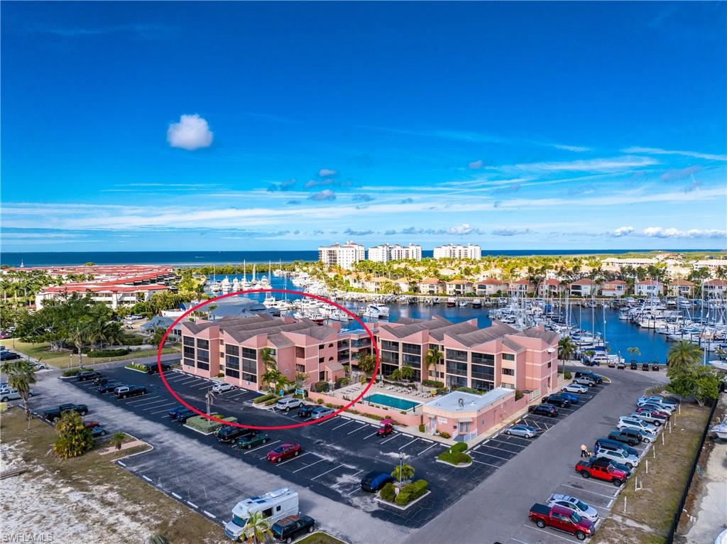 Welcome to this beautifully maintained first-floor, fully furnished condo in the highly sought-after Keel Club at Burnt Store Marina. An extremely rare opportunity in Southwest Florida for both investors and seasonal owners alike. With absolutely no rental restrictions or minimum lease requirements, properties like this are truly one in a million. Whether you are looking for a high-performing Airbnb, vacation rental, seasonal retreat, or full-time residence, this condo offers unmatched flexibility and income potential. Even better, the seller already has the unit rented for the 2027 season, giving the next owner immediate future income in place. Offered turnkey and move-in ready, the condo is ideally located just steps from the waterfront restaurant, marina office, The Trading Post deli, and the heated community pool. Notably, the unit experienced no flood damage from any hurricanes, providing valuable peace of mind. Inside, you will find a bright updated living space, a spacious bedroom with a king-size bed and newer Berber carpet, and an enclosed lanai with solar-tinted vinyl panels and screens perfect for year-round enjoyment. A large utility closet includes an in-unit washer and dryer, while the kitchen features stainless steel appliances. Recent upgrades include a 2022 water heater and a new A/C motor installed in 2025 with routine servicing twice per year. One of the biggest draws is the world-renowned Safe Harbor Marina, attracting boaters and visitors from around the globe. Residents and guests enjoy waterfront dining, observation decks, abundant wildlife, dolphin sightings, and optional memberships for golf, fitness, tennis, pickleball, bocce, and social activities. Rarely do condos in SWFL offer this level of lifestyle, flexibility, and unrestricted rental potential all in one package.