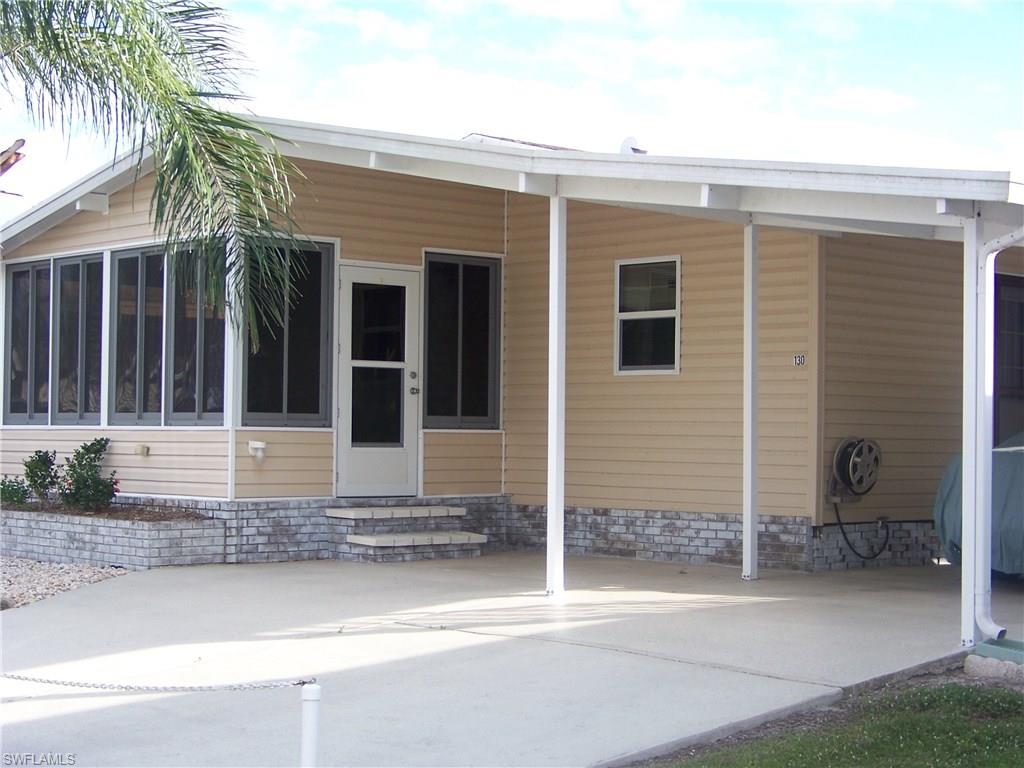 Take a look at this STUNNING home located in Beautiful Burnt Store Colony...the "Mercedes Benz" of community living! This extremely well maintained, LOVELY turn key-/furnished home w/land share,offers 2 nice sized bedrooms w/walk-in closets, 2 baths, a HUGE inside laundry room, LG great room, kitchen, lanai & shed! The floor plan is spacious & adorned w/stunning QUALITY tasteful furniture. Newer items since 2012: COMPLETE NEW TOP OF THE LINE MEMBRANE ROOF done Dec. 2018 w/15 year warranty!, Aluminum drip edge, Re-plumbed w/CPVC, A/C unit, Both baths: sinks, faucets, light fixtures, backsplash & tile floors, w/d, Wood-like insulated lam. floors, 2 c. fans, complete int. paint & baseboards, new hardware on all doors & kitchen cabs, kitchen counter tops, s/s sinks & faucet, backsplash & MORE! All windows were replaced in 2005. Lanai has all weather acrylic tinted windows & tile floor. Insulated shed is good size & even has a working sink for easy clean up! This home is ready to go & shows VERY NICE! The park allows pets & offers an array of recreational entertainment & fun! Come take a look at this MOVE-IN READY BEAUTY, you will be so glad you did!!!