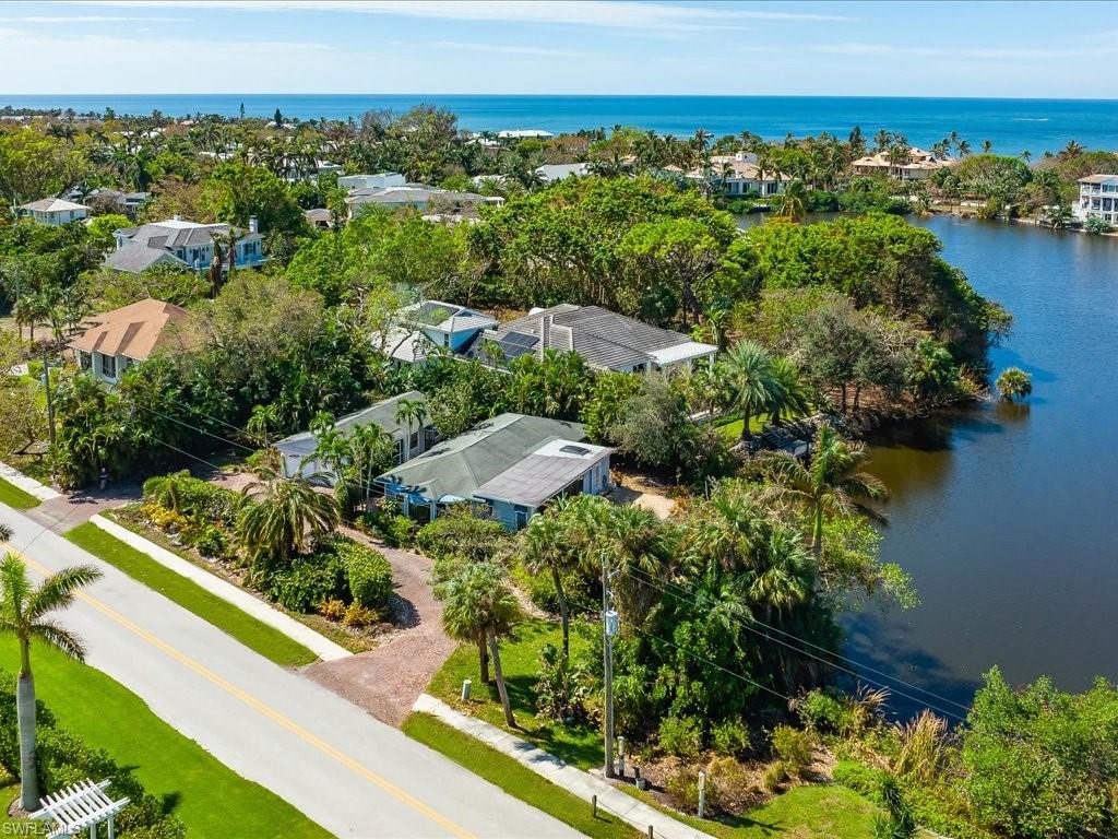Let your creative vision and dreams begin! This rarely available third of an acre lot sits on a lake just 2 blocks off the beach in the highly sought after Olde Naples neighborhood. Enjoy proximity to downtown and the arrival of the new Four Seasons resort just a few blocks away. This lot features a private city park on one side and unobstructed amazing Southwestern exposure for fabulous sunsets. The private city park gives this special lot the feel of being even larger. On the other side is another property with significant and lush landscaping for additional privacy.