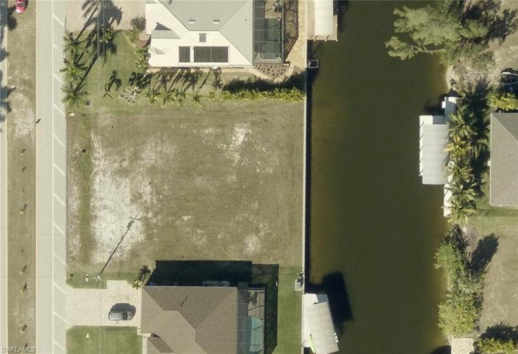 ***GULF ACCESS TRIPLE LOT WITH SEAWALL*** In the sought after Northwest Cape, easy access to Charlotte Harbor & the Gulf. Only ONE bridge to open water. This lot is cleared and ready to build, surrounded by beautiful and very well maintained homes. It's a short  drive to Punta Gorda Airport and very easy access to Veterans Parkway and Fort Myers.